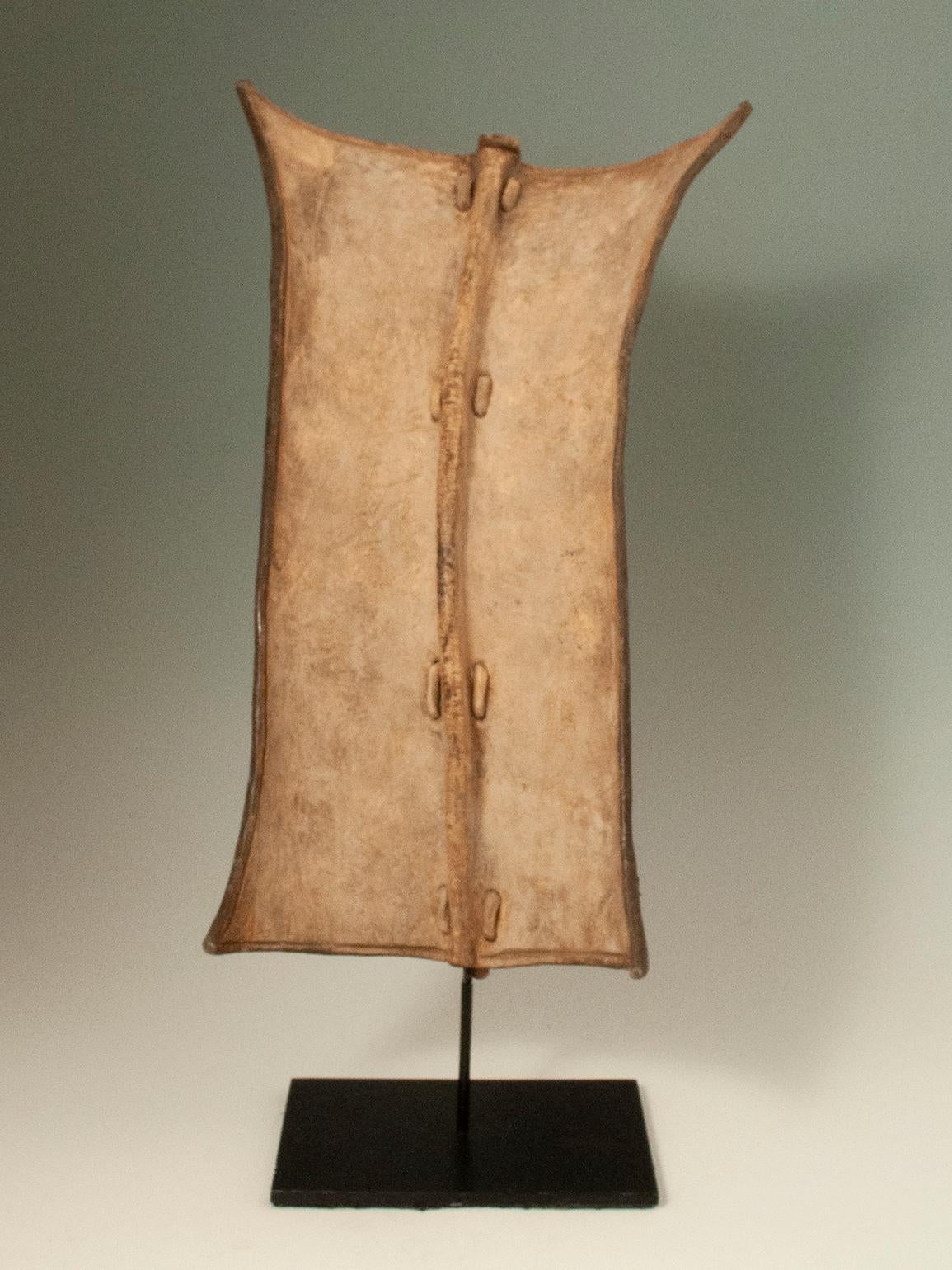 Leather Shield, South Sudan

A small leather shield typical of the region known as an upwal, concave hide is attached to a reed spine with plaiting to form a strong grip. Mounted on a custom base.
Ex Bryan Reeves, London.






 