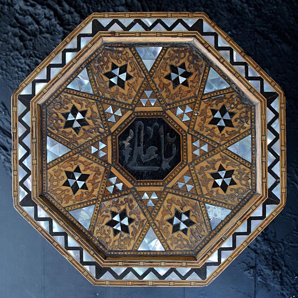 Early 20th century Liberty & Co Syrian table

We are proud to offer a beautiful early 20th century Liberty & Co Syrian table with hexagonal form. This highly decorative table is inlaid with teak, bone, mother of pearl, and ebony. A wonderful