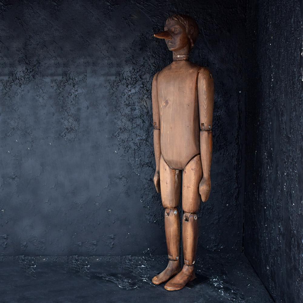 Early 20th Century Life Size Articulated Hand Carved Pinocchio Figure

Artistic, sculptural, unusual, dark, creepy, and out of the ordinary springs to mind when you first see this figure in person. This figure does stand alone, however we have