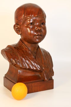 Early 20th century life size walnut bust of a boy by George Henry Paulin RBS