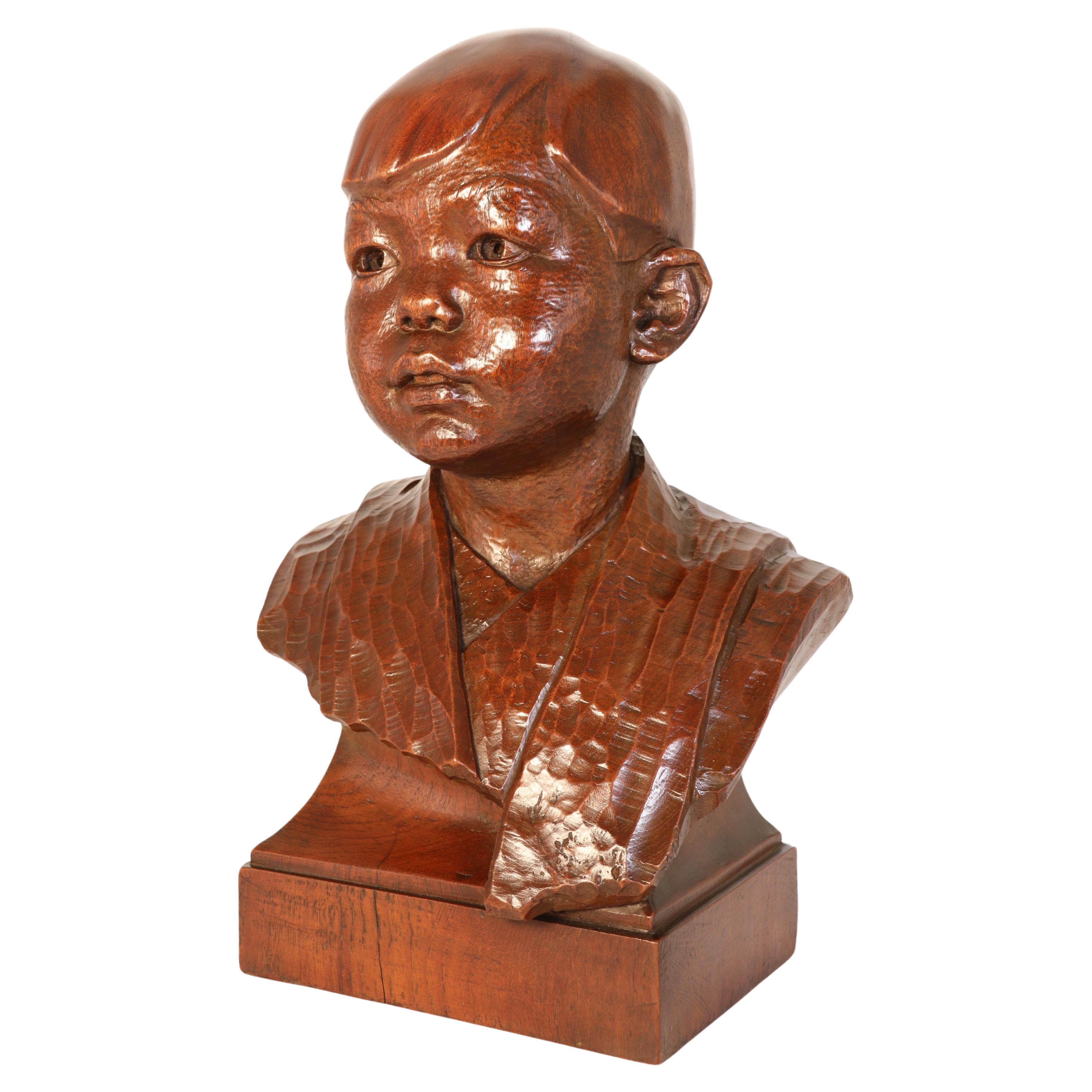 Early 20th century life size walnut bust of a boy by George Henry Paulin RBS