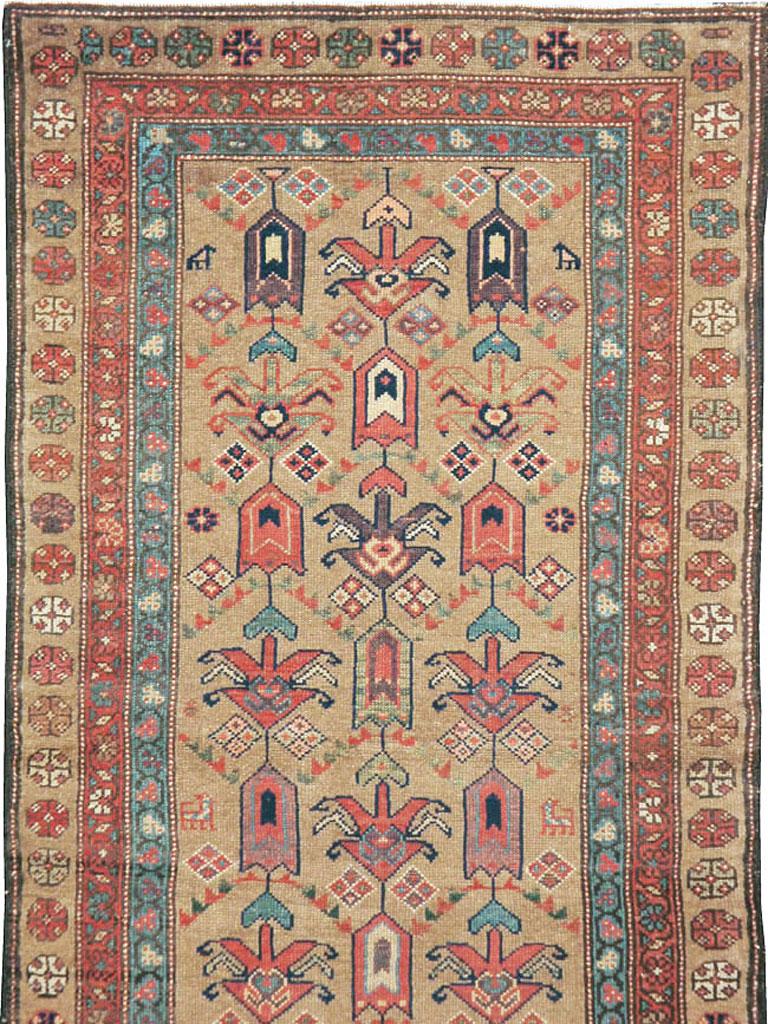 Hand-Knotted Early 20th Century Light Brown, Purple, Rust, and Blue Persian Tribal Runner