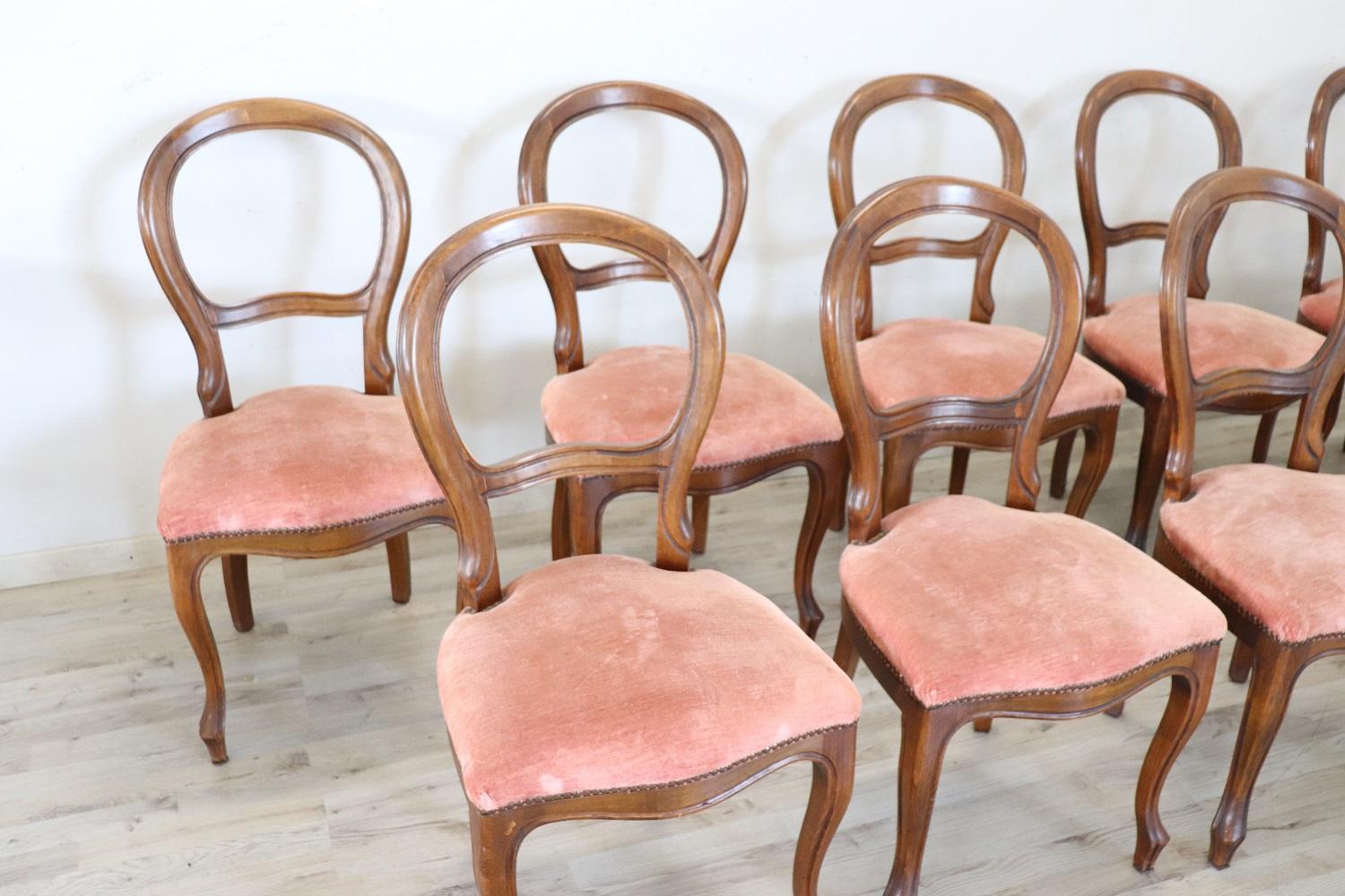 Early 20th Century dining room set of ten chairs in solid beech wood. The chairs are very elegant with very slender and solid moving legs. The seat is wide and comfortable in velvet. The chairs are in wood and padding perfect condition, small signs