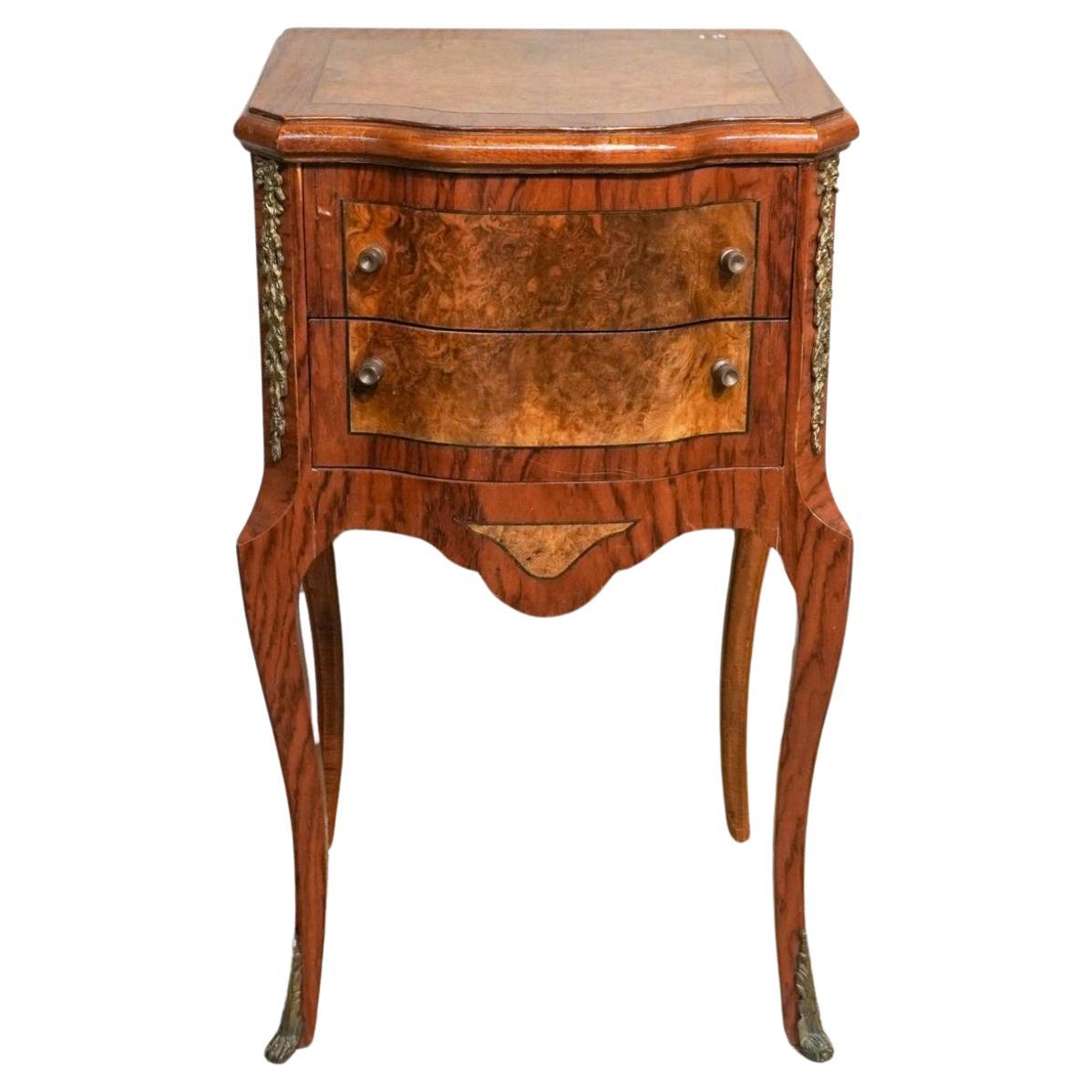 Early 20th Century Louis XV Style Brass Mounted Inlaid Burl Fruitwood Side Table.
Measure 17.25W x 13 x 30.75H.
Drawers are 12.5