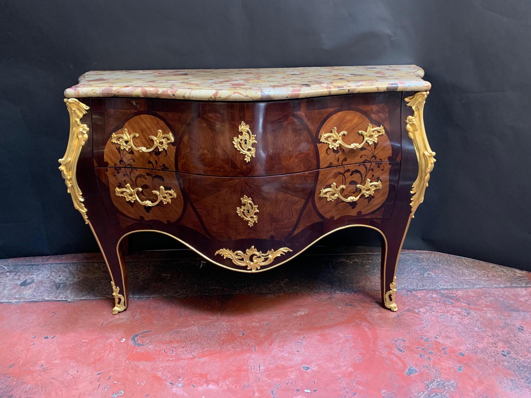 Louis XV style gilt bronze marquetry commode with mounted marmol. France, early 20th century.