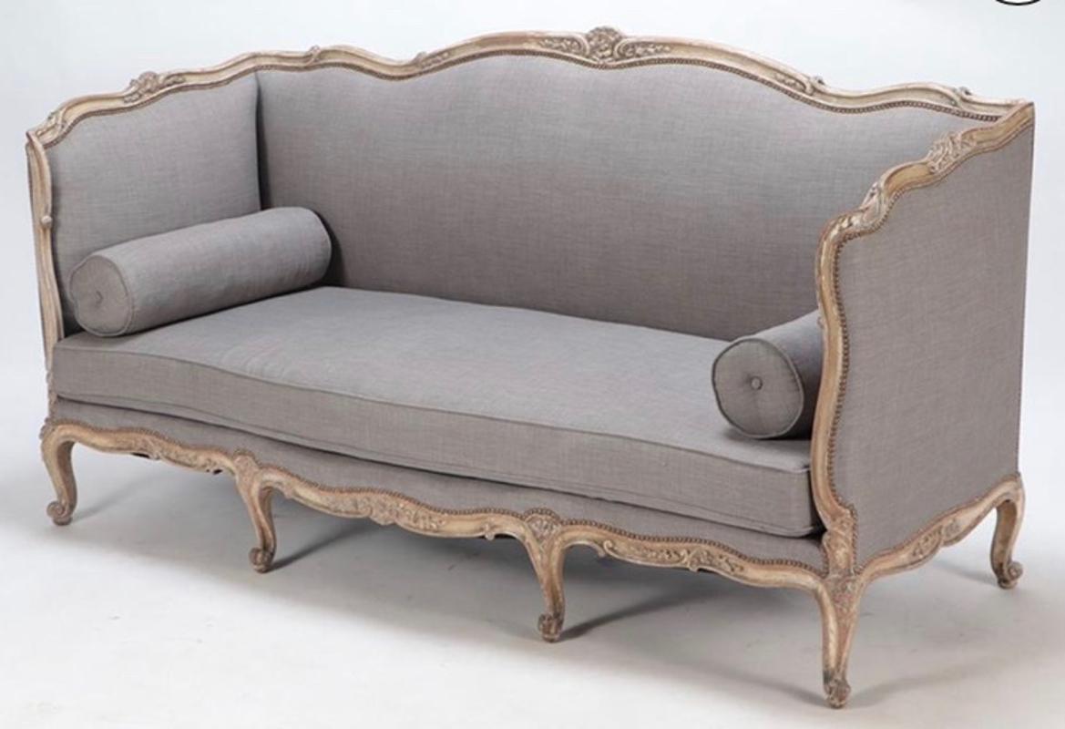 Early 20th century Louis XV Style Painted Patina Newly Upholstered Arm Sofa
Nicely carved frame having worn painted patina and a lovely light gray linen upholstery. Includes to bolster pillows. Europe, circa 1900. Measures: 42.75