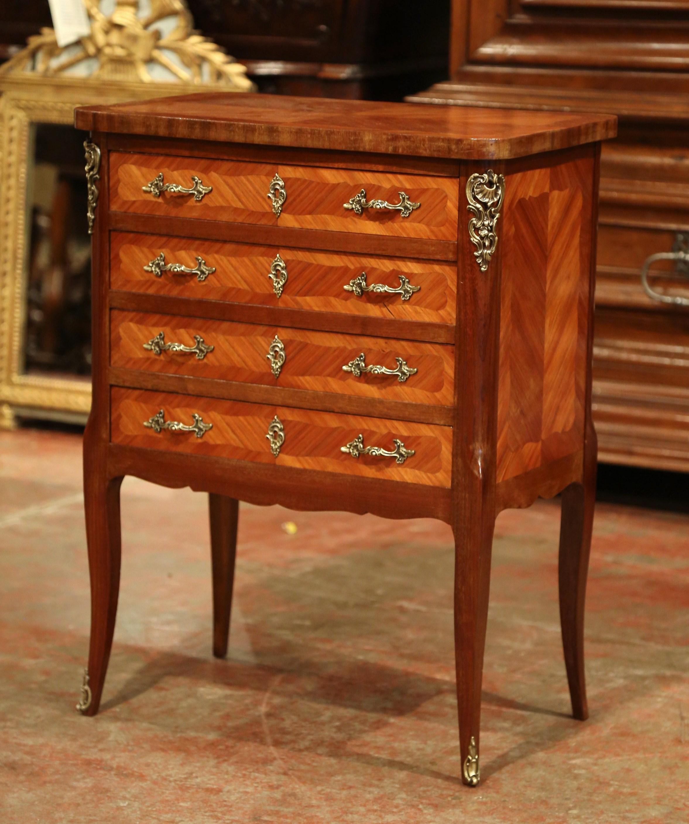 This elegant, Louis XV antique walnut commode is an essential for entertaining. Created, circa 1920, the chest is outfitted with a complete menagere flatware set with an impressive 145 pieces. The traditional four-drawer chest is not only a