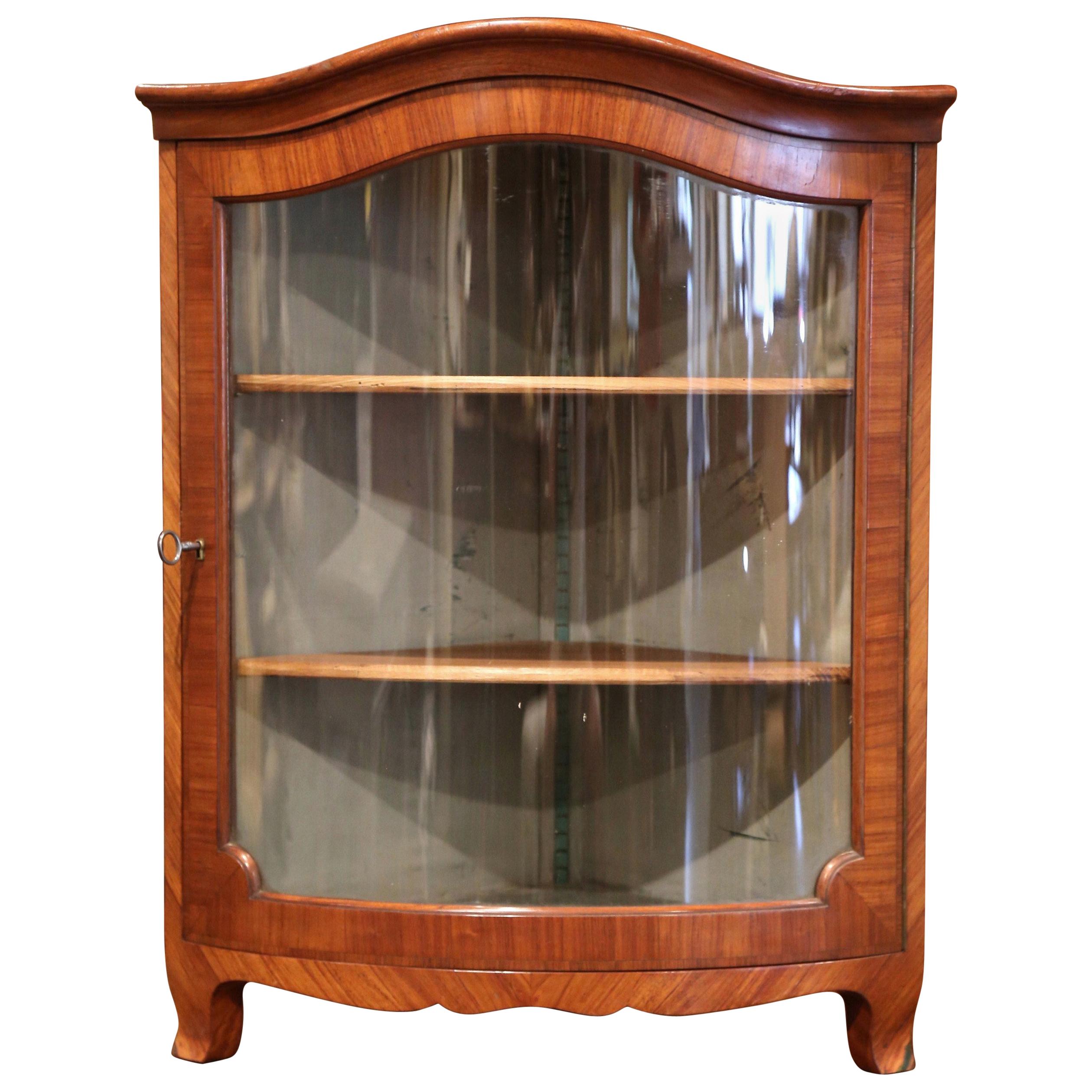 Decorate a powder room or breakfast room with this elegant antique wall corner cabinet. Created in southern France circa 1920, the 