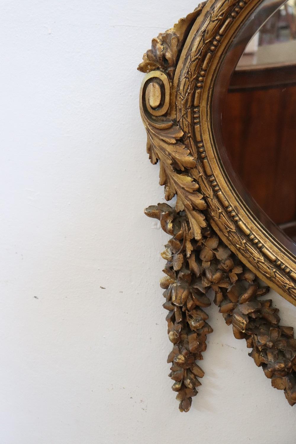 Italian Early 20th Century Louis XVI Style Carved and Gilded Wood Oval Wall Mirror