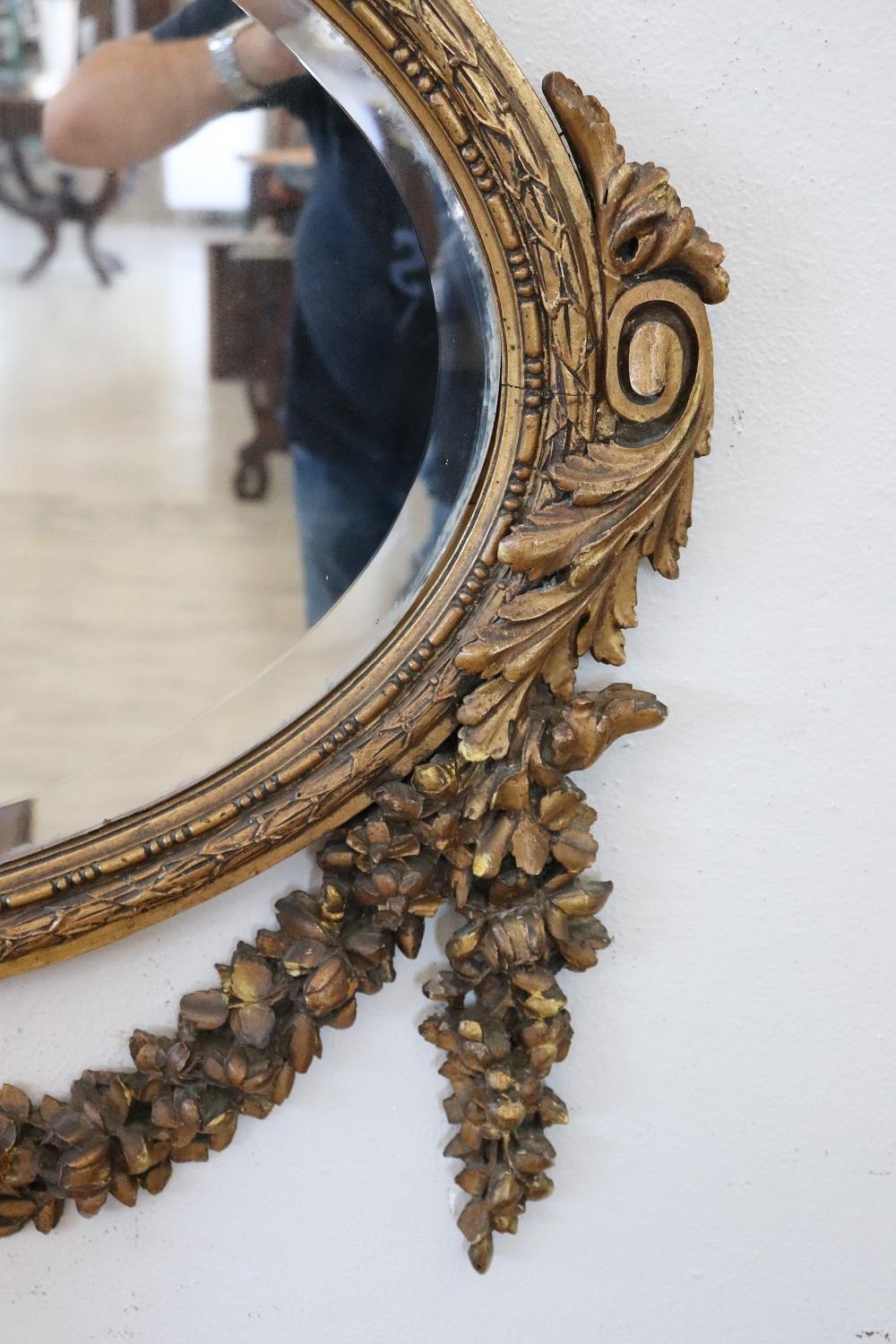 Mid-20th Century Early 20th Century Louis XVI Style Carved and Gilded Wood Oval Wall Mirror