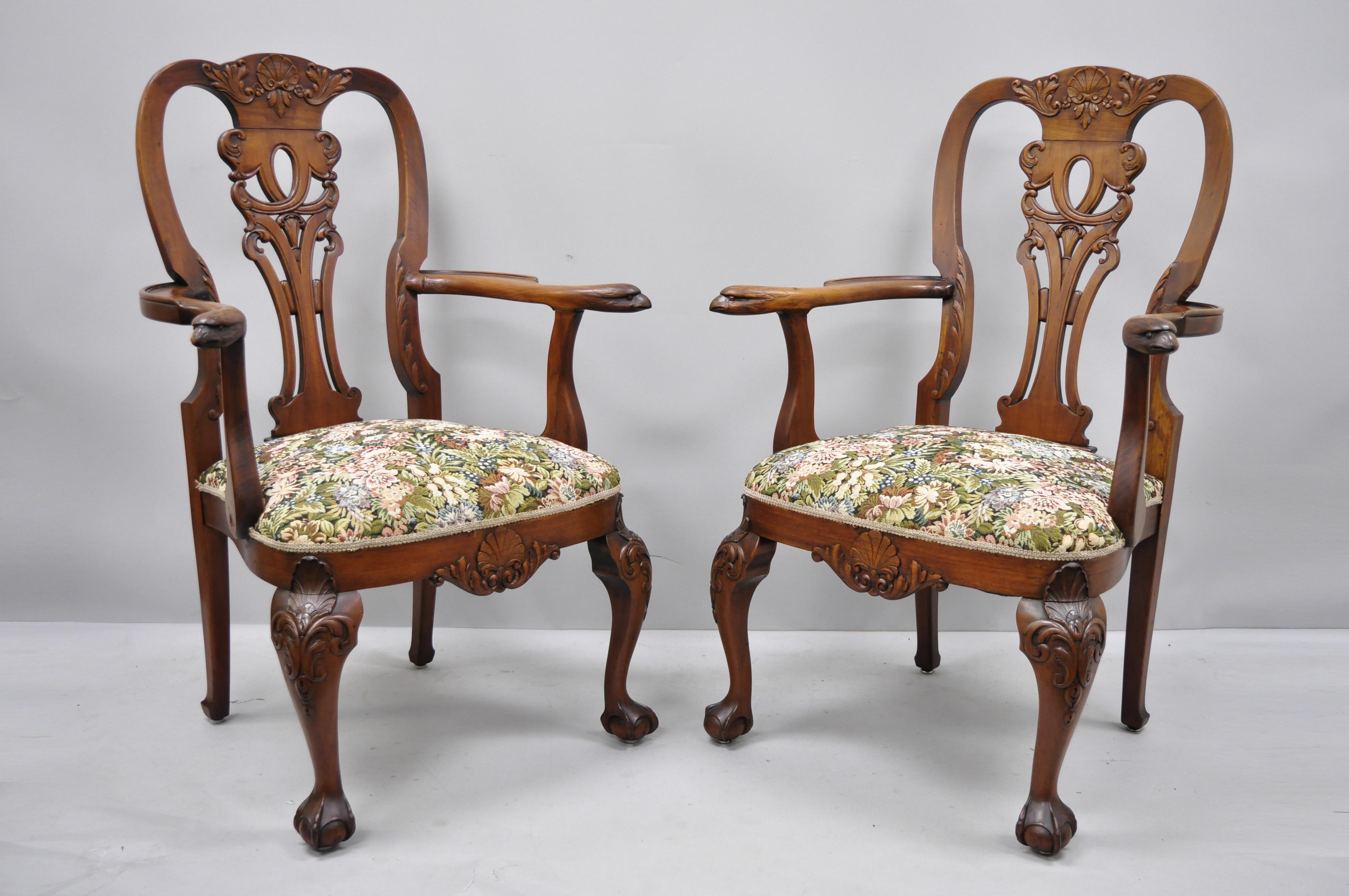 Early 20th century mahogany Chippendale style armchairs carved with eagle heads. Item features eagle head carved armrests, ball and claw feet, shell carved knees and lower rail, acanthus leaf carved scrollwork, solid wood construction, beautiful