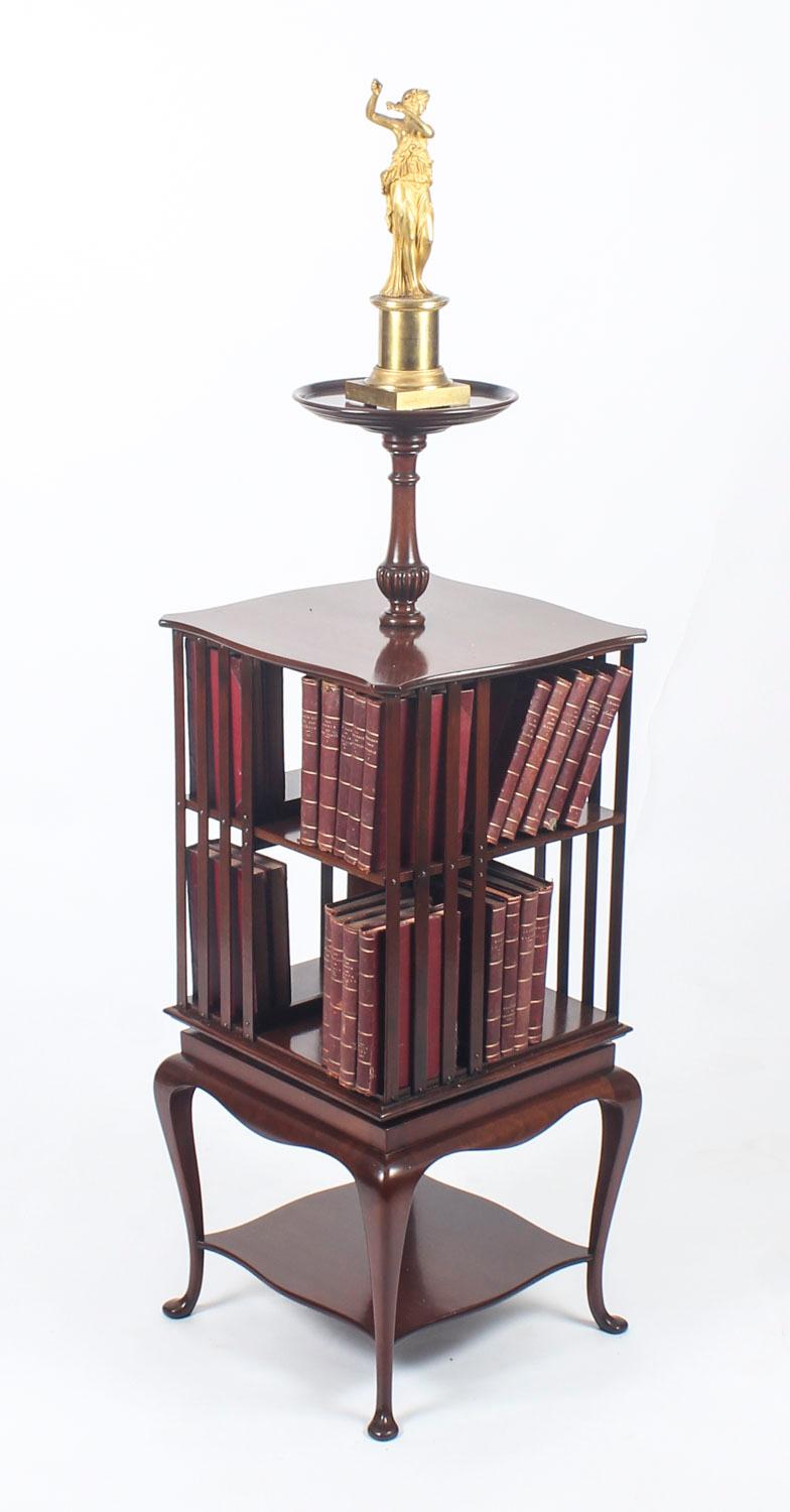This is an exquisite and unusual antique Edwardian mahogany revolving bookcase, circa 1900 in date.
 
The bookcase has useful revolving compartments for books and stands on four cabriole legs united by a low shaped shelf. There is a prominent raised
