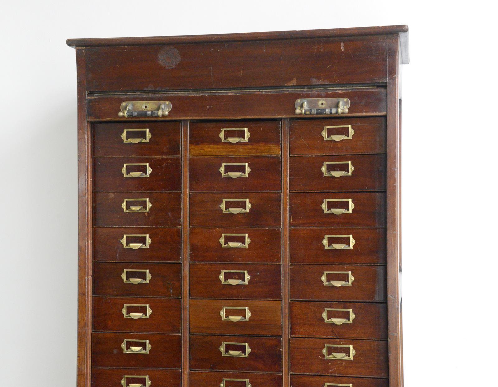 Early 20th century mahogany solicitors drawers

- Mahogany drawers
- Panelled sides and back
- Original brass pulls
- Original sprung documents holder in the drawers
- English ~ 1900
- 91cm wide x 57cm deep x 208cm tall
- The 4 large drawers