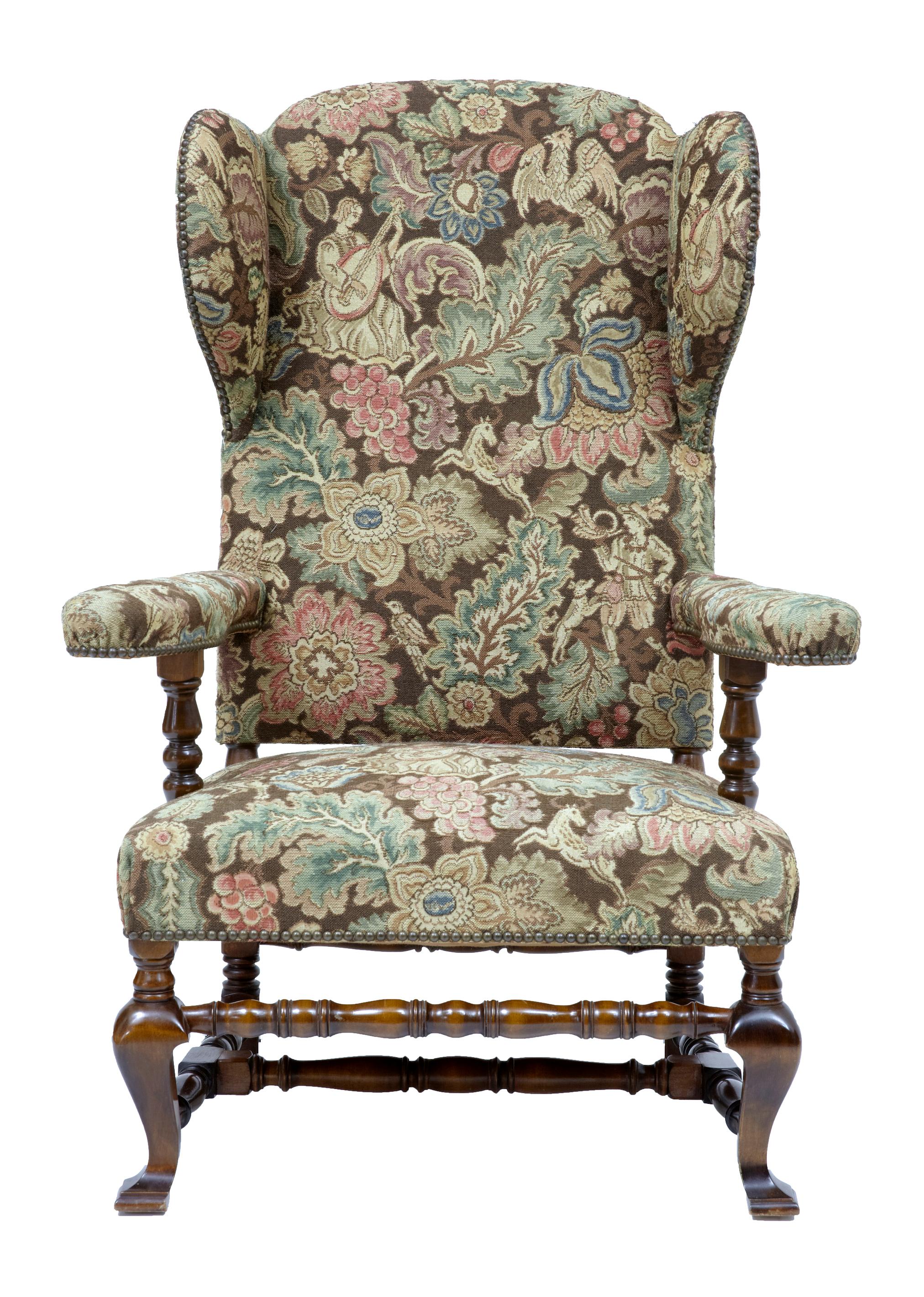 Early 20th century mahogany wingback armchair, circa 1920.

Here we have a fine tapestry covered very comfortable wingback armchair. Upholstered in a superb quality floral tapestry with mythical beasts. Shaped arms with well padded back