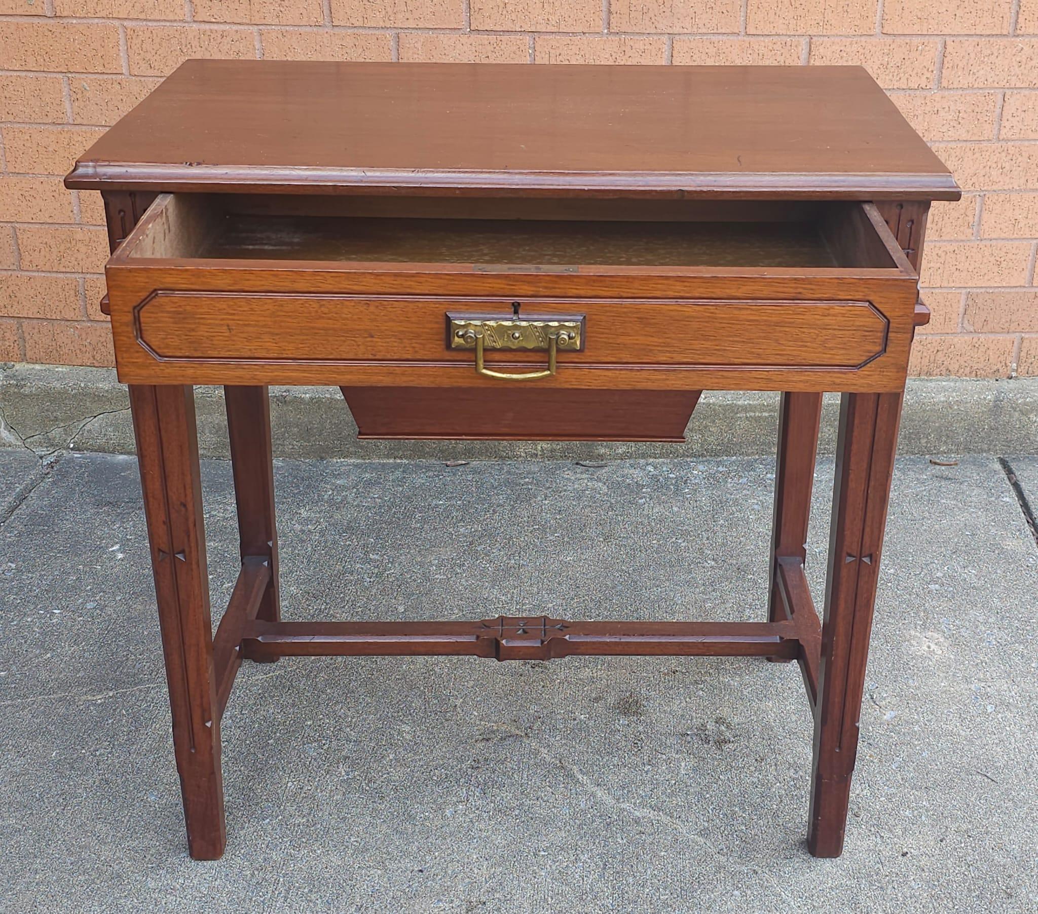 An early 20th Century Victorian Style Mahogany Work Table or Sewing Table in great antique condition. 

Measures 39.25