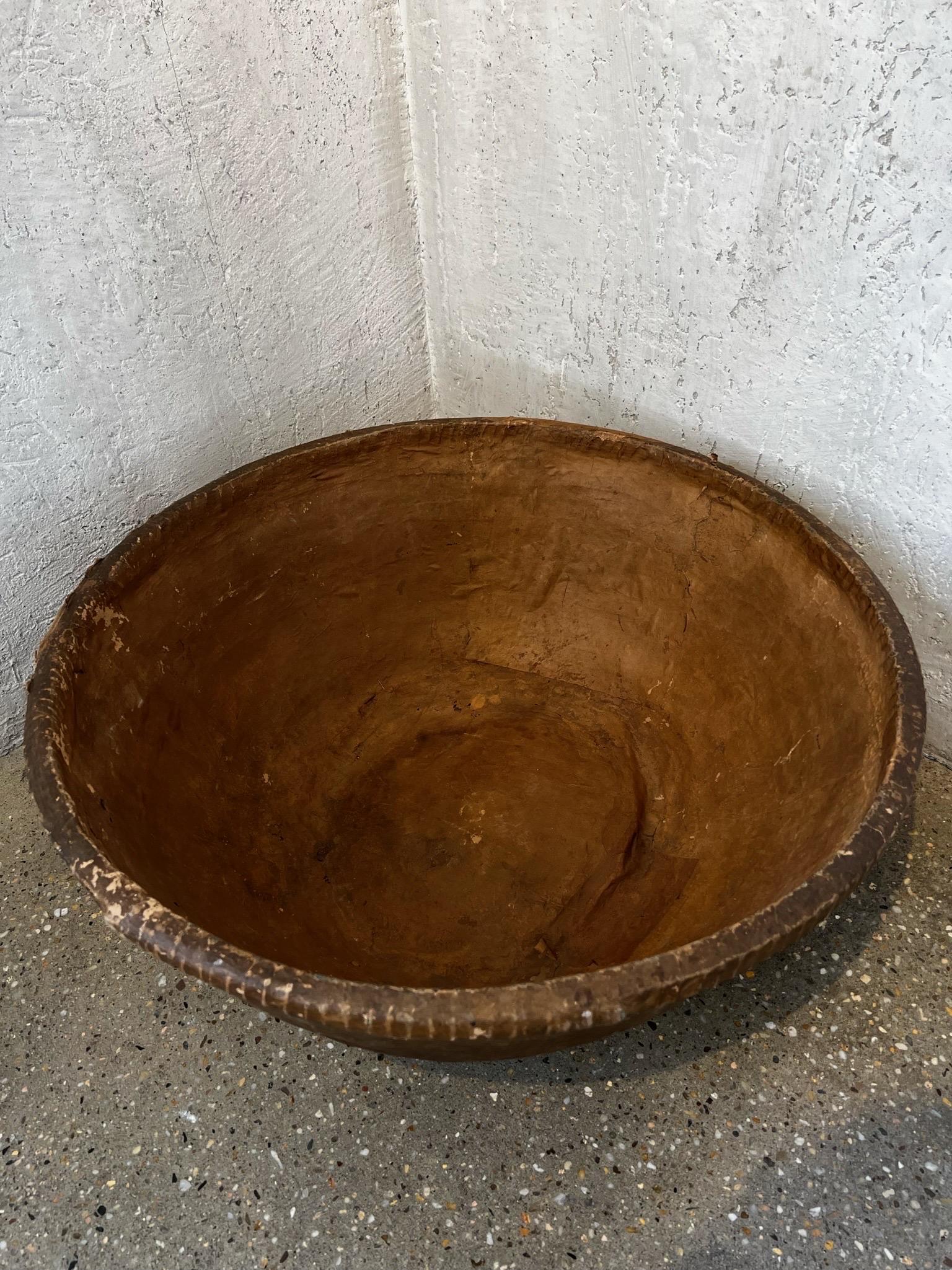 The scale of this papermache’ bowl is unusual and spectacular. The color, stitching and scale make this an object d’ art. 
Three pieces available. Sold separately.