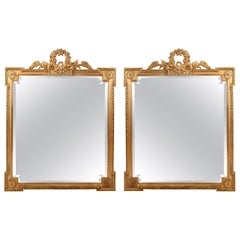 Early 20th Century Matching Pair of Giltwood Hanging Beveled Mirrors