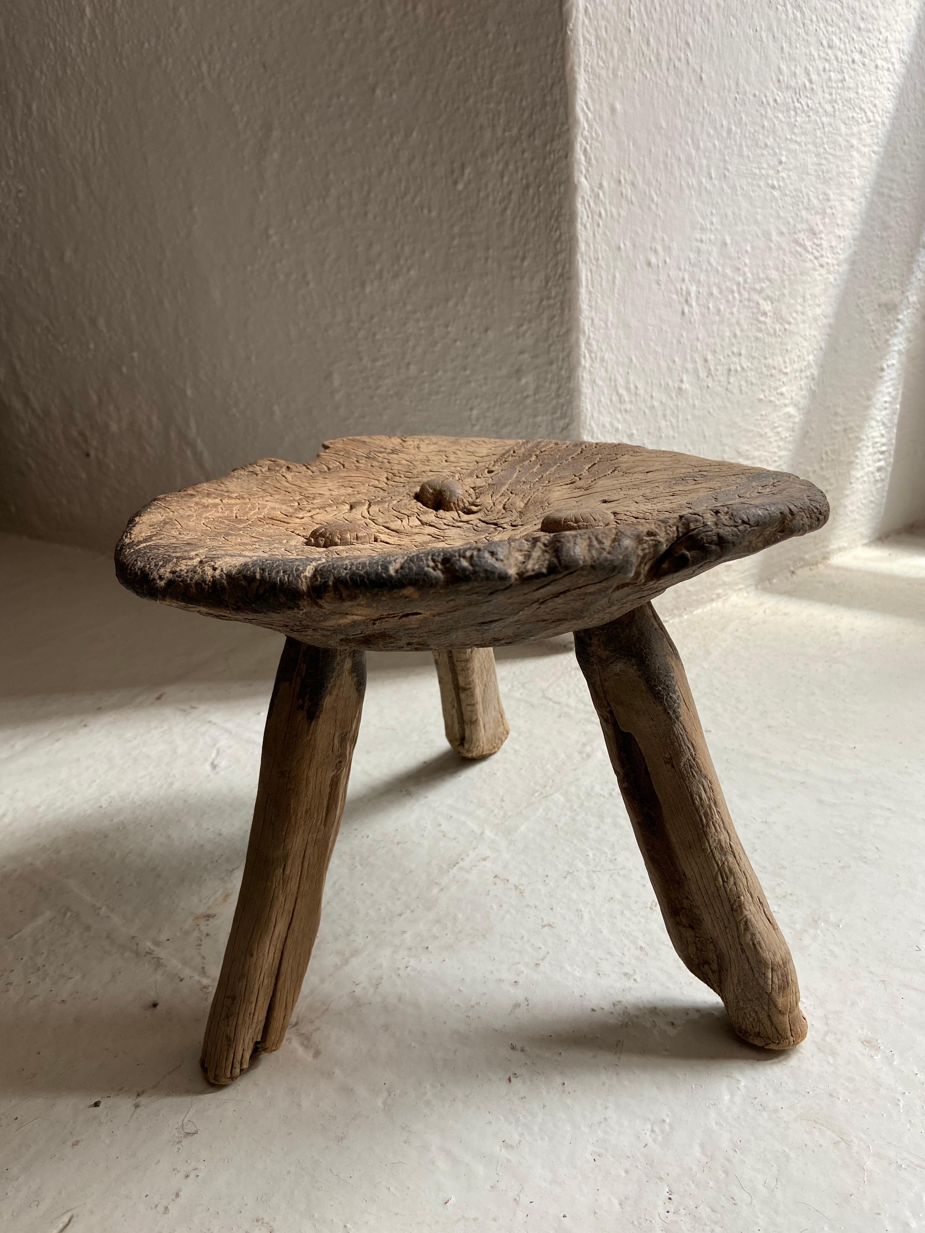 Antique mesquite stool from Venado, San Luis Potosi, Mexico, hand carved, circa early 1900s. Weathered mushroom-like patina throughout. Structurally solid with legs completely intact. All original parts.