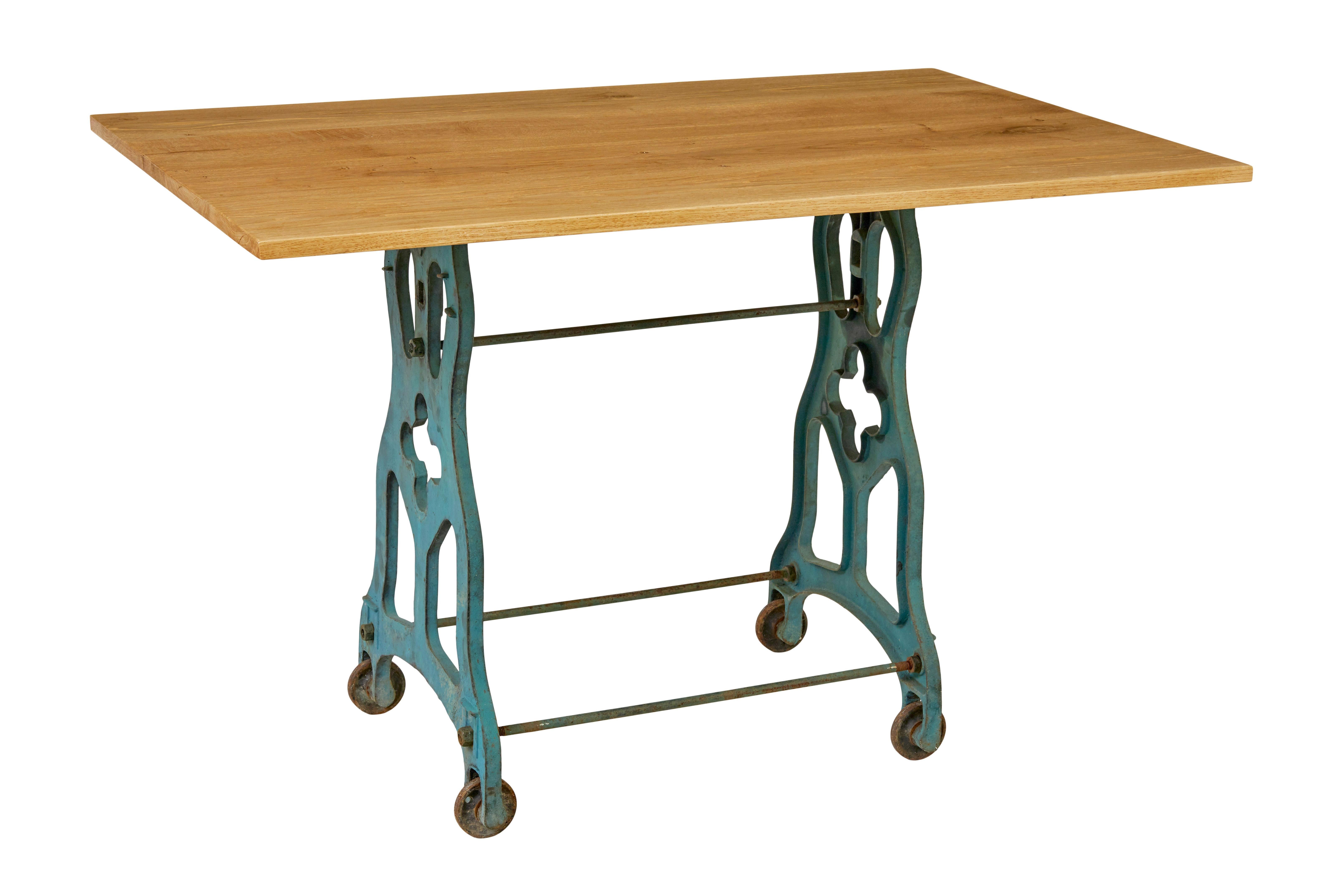 Early 20th century metal table base with solid oak top

Here we present an iron table base with original paint, with later solid oak top.

Good quality table that would work equally well in the hallway or in the garden room.  Cast iron base with