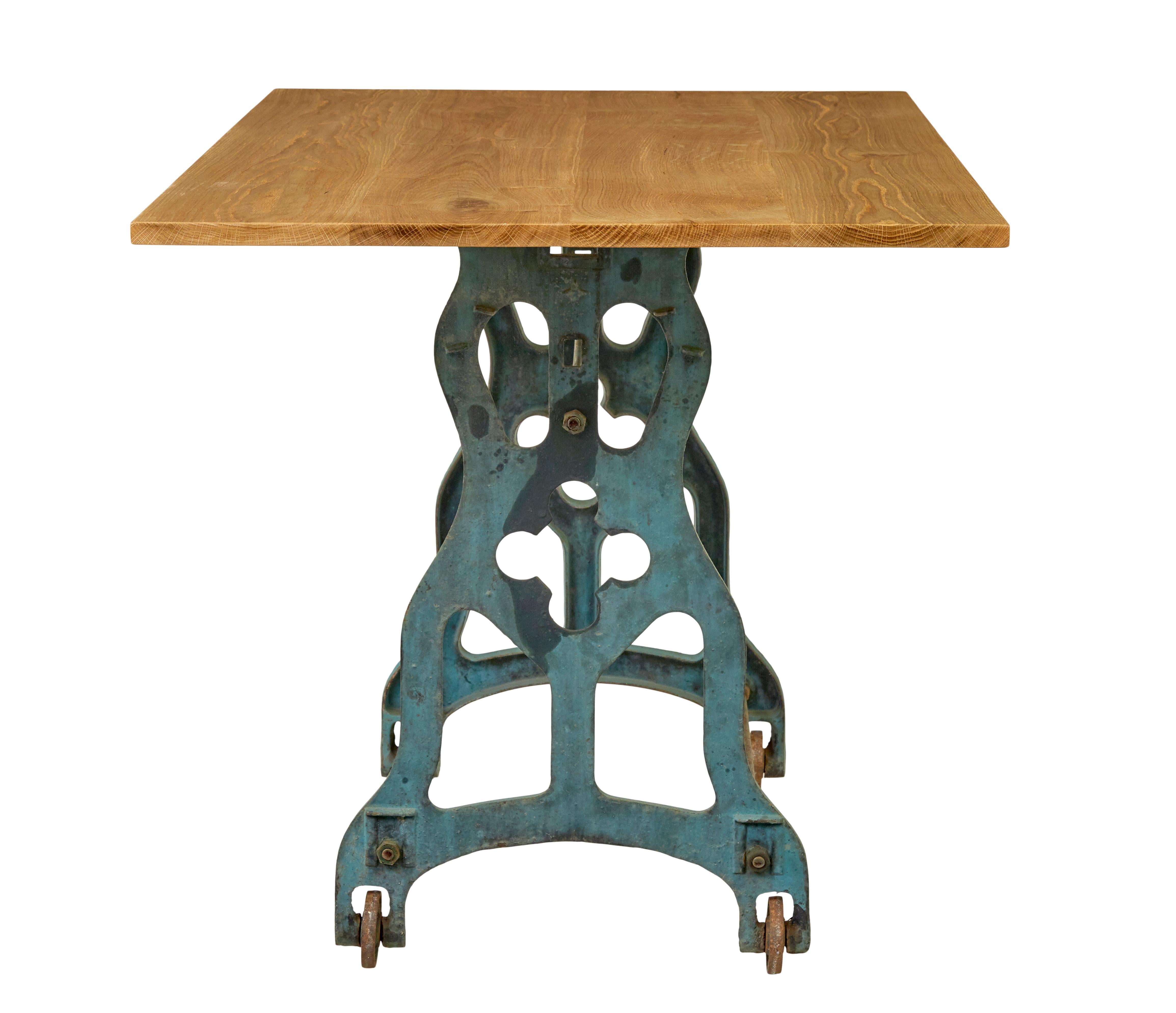Cast Early 20th century metal table base with solid oak top
