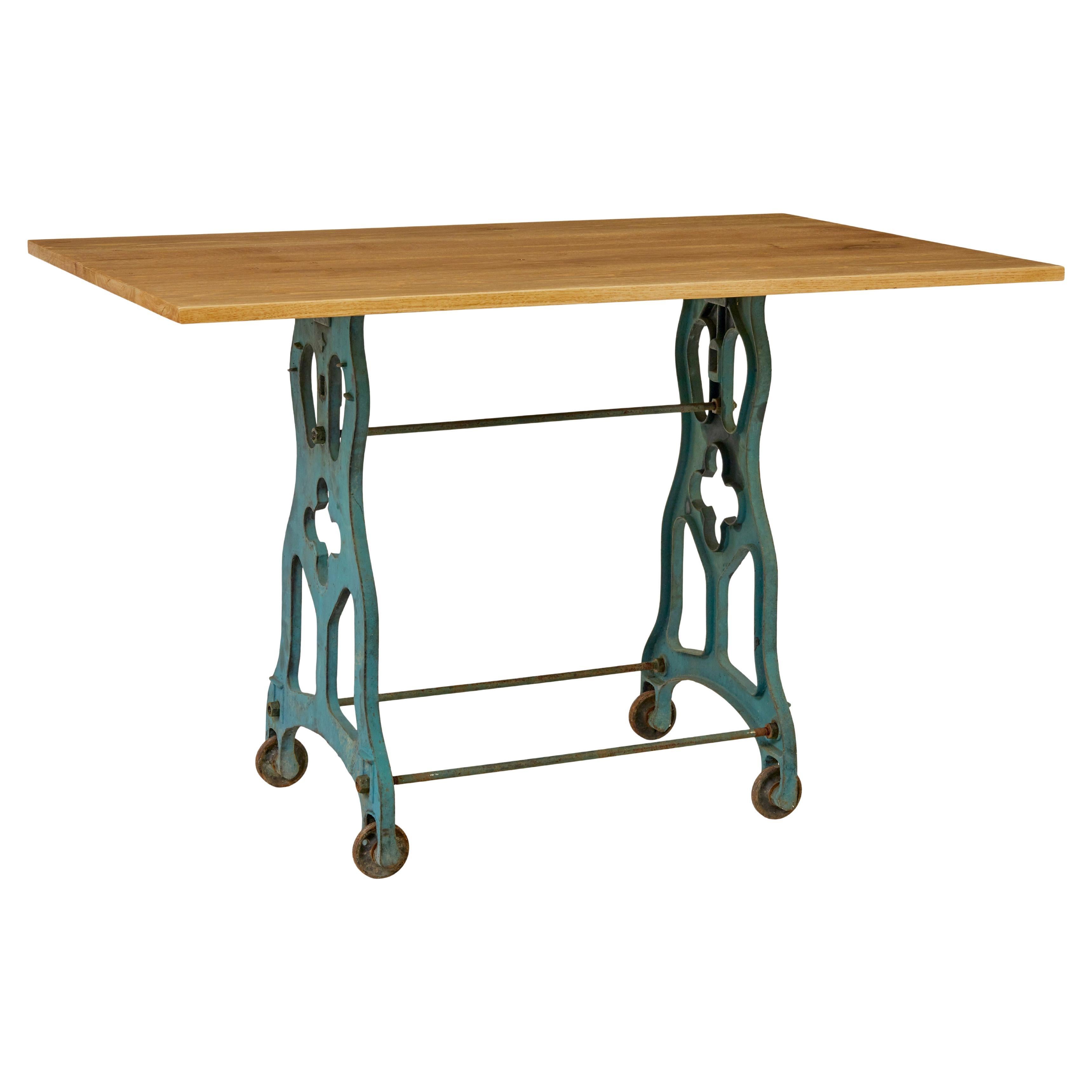 Early 20th century metal table base with solid oak top