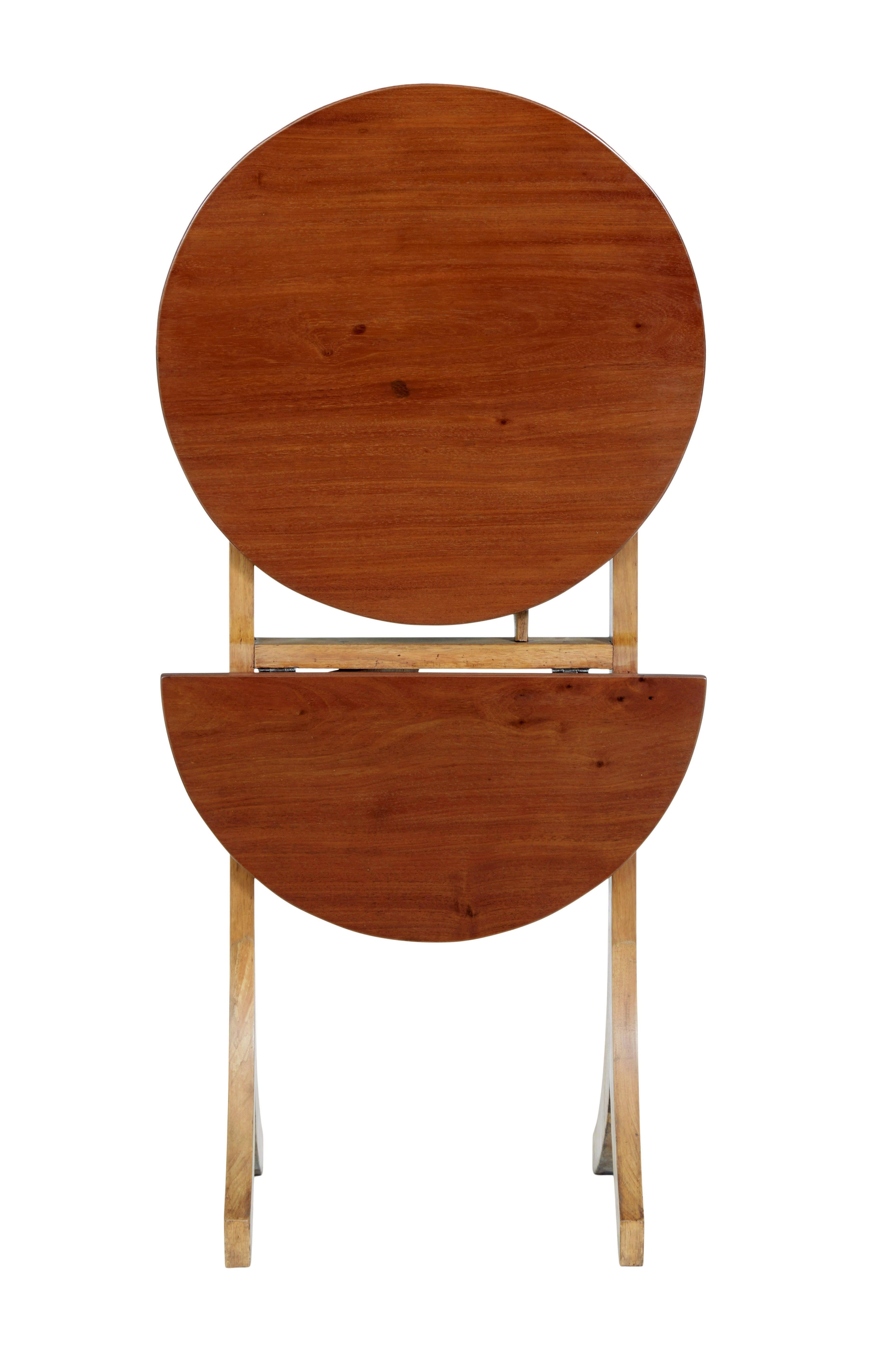 Hand-Crafted Early 20th century metamorphic mahogany occasional table For Sale