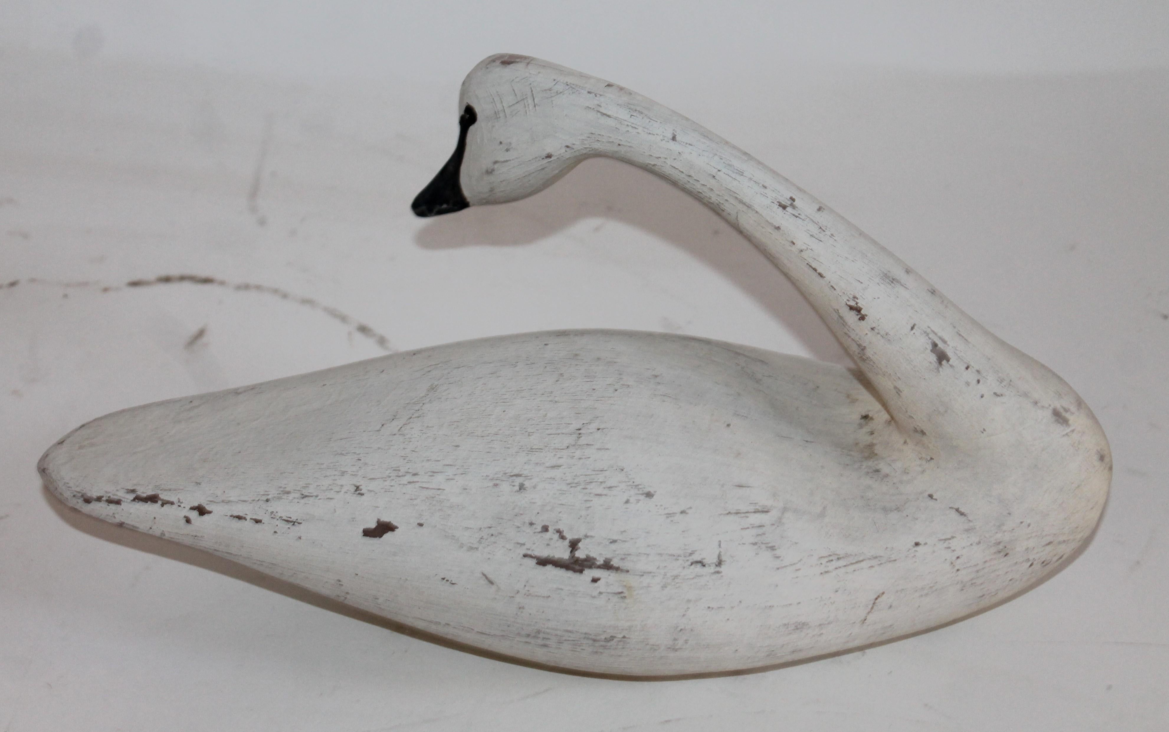 This fine hand-carved and painted swan is in fine condition. This bird is most unusual form.