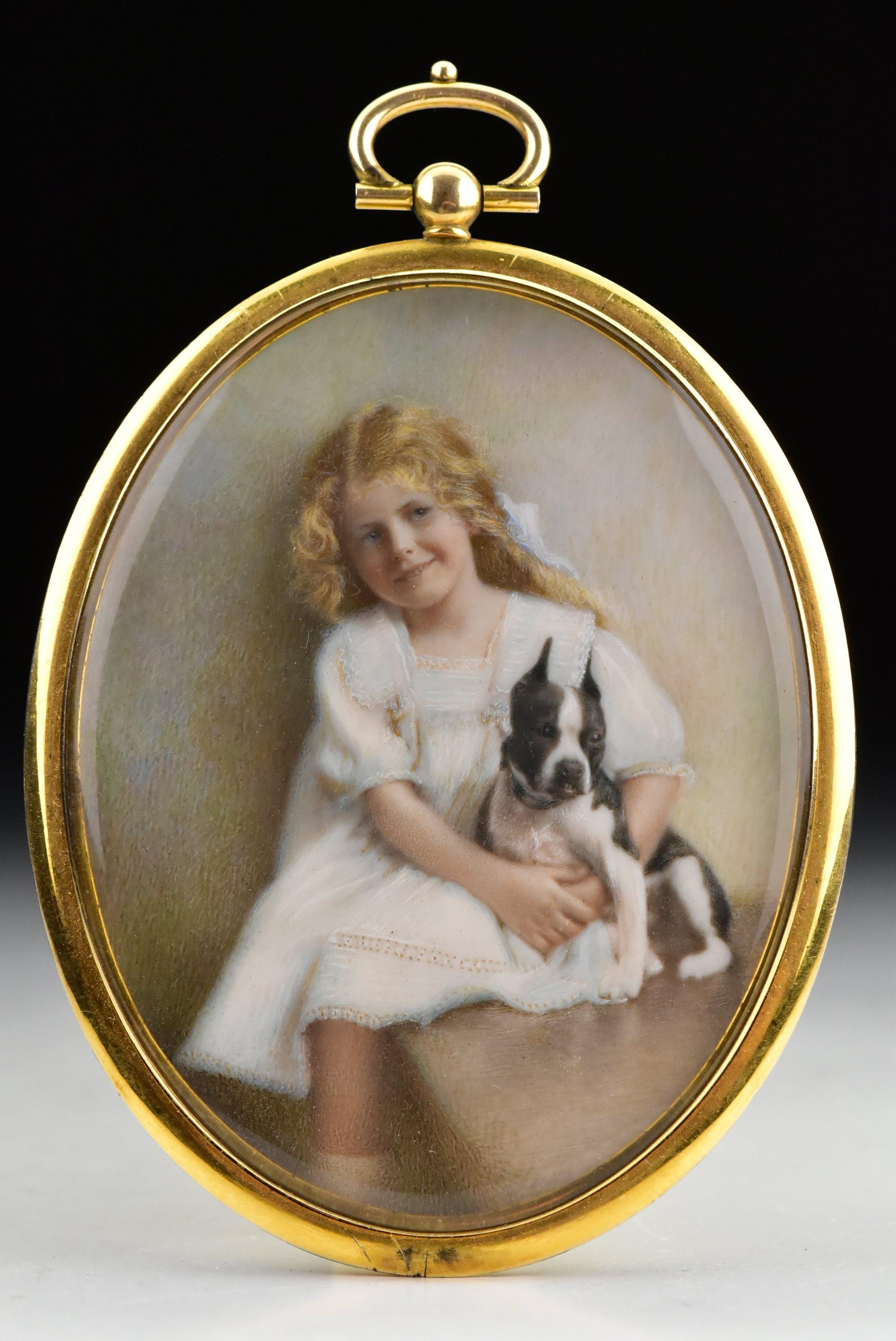Description: Miniature portrait painting of a young girl seated with her arms around her terrier, set in a gold gilt frame with bale at the top.

Age: Early 20th century.

Size: What can be seen of the painting itself measures approximately 3 +