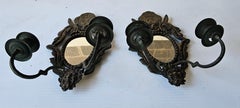 Paire d'appliques murales à bougies en bronze miroité du début du 20e siècle