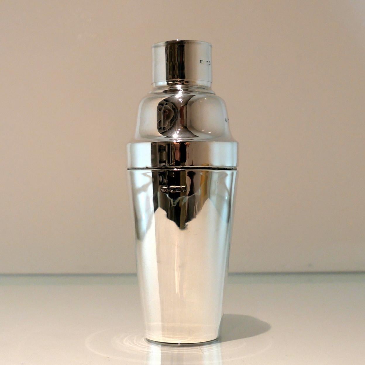 A stylish and highly desirable George V silver three sectioned plain formed cocktail shaker.  There is a very unusual silver wire strainer insert in order for easy pouring.

 

Weight:  16 troy ounces/498 grams

Height:  8.6 inches/22cm

Diameter: 