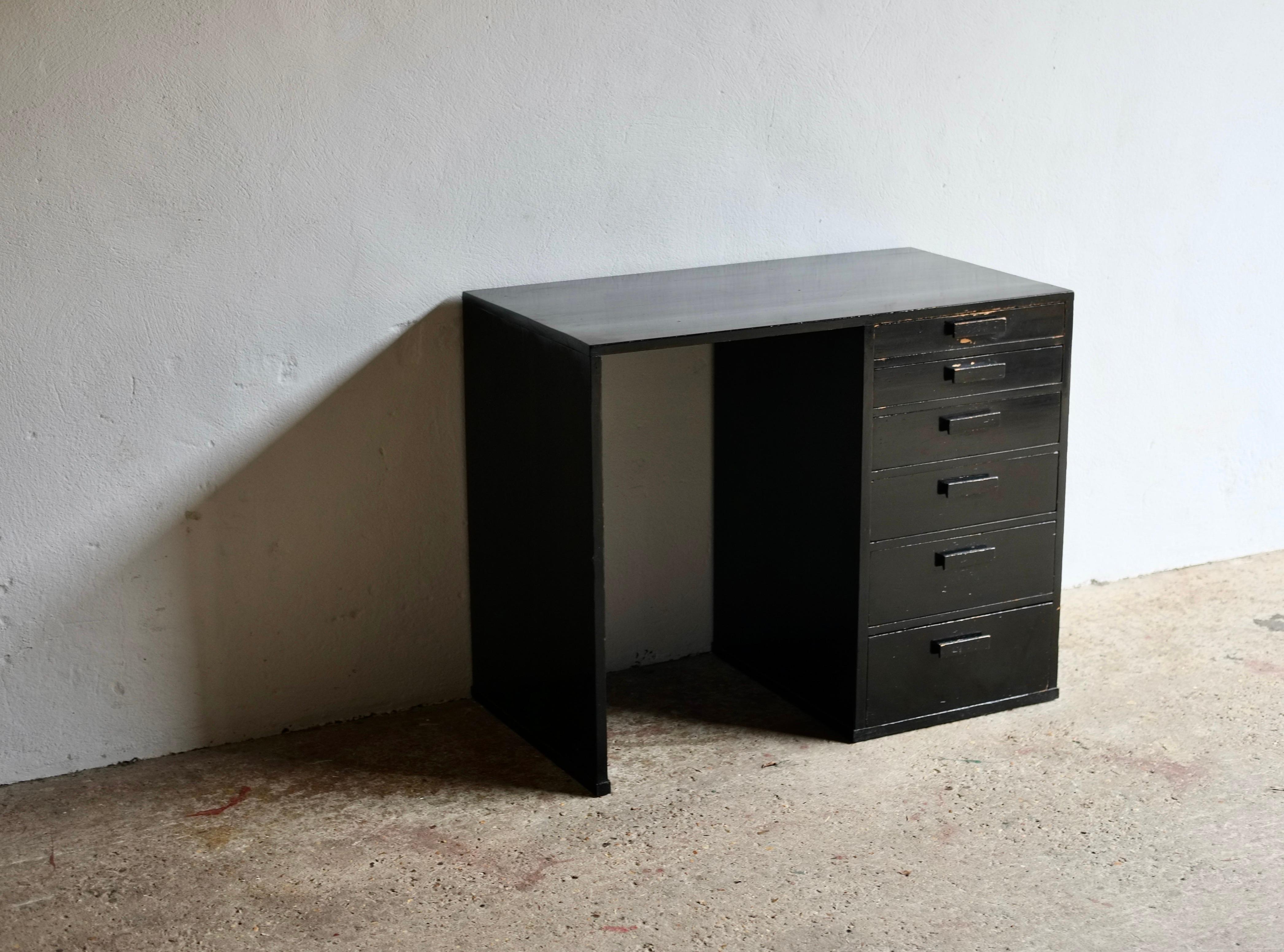 A most beautifully proportioned ebonised early to Mid-20th Century modernist desk. 

Featuring six varying sized drawers the desk is in good vintage condition with light wear to the paintwork. 

From the collection of window dresser, clothing