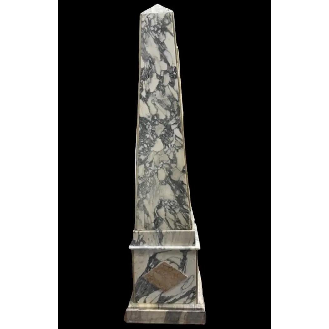 Extremely rare and decorative pair of Grand Tour Marble Obelisks from the early 20th century. They use a couple of different marble in a gorgeous design. Breathtaking in person.  There are chips and cracks commensurate with age.