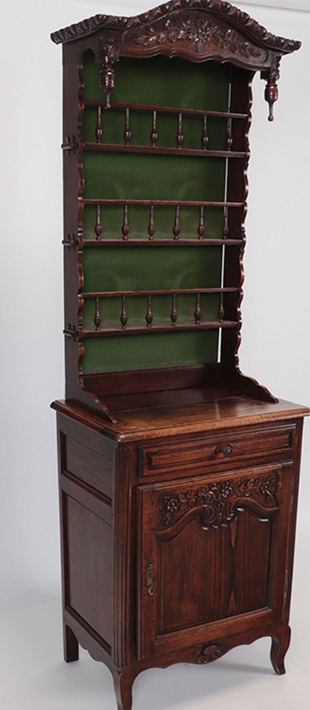 Early 20th century Narrow French Oak Hutch with single door and drawer
Lovely details in the woodwork of this rare piece. Three open shelves above one drawer and one door cabinet which conceals an inner shelf. 
France, circa 1910.
Measures: 79