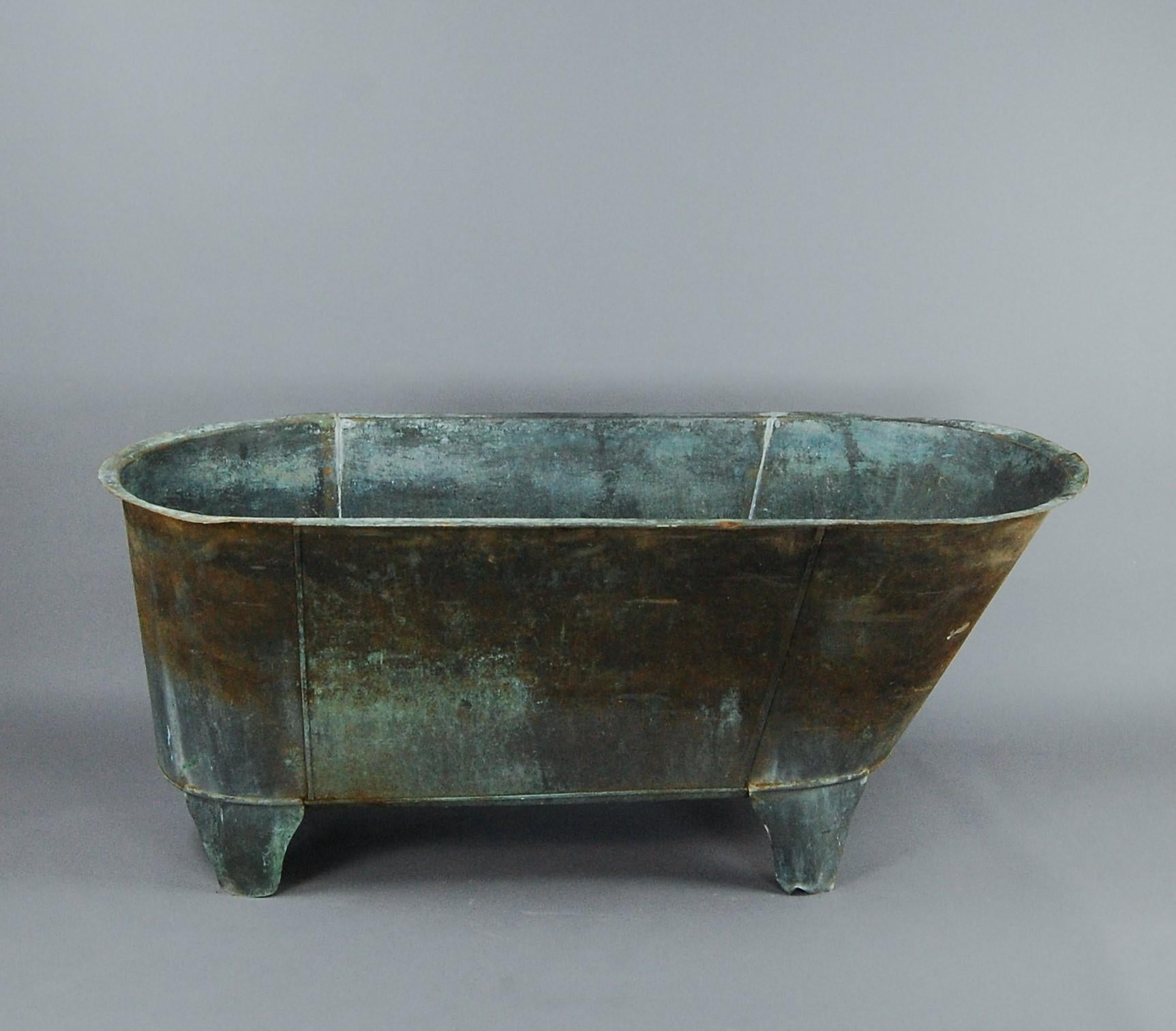 Early 20th century, copper bath, wonderful natural verdigris patina, original feet. Could be pressed back into service or used in the exterior garden setting.
   