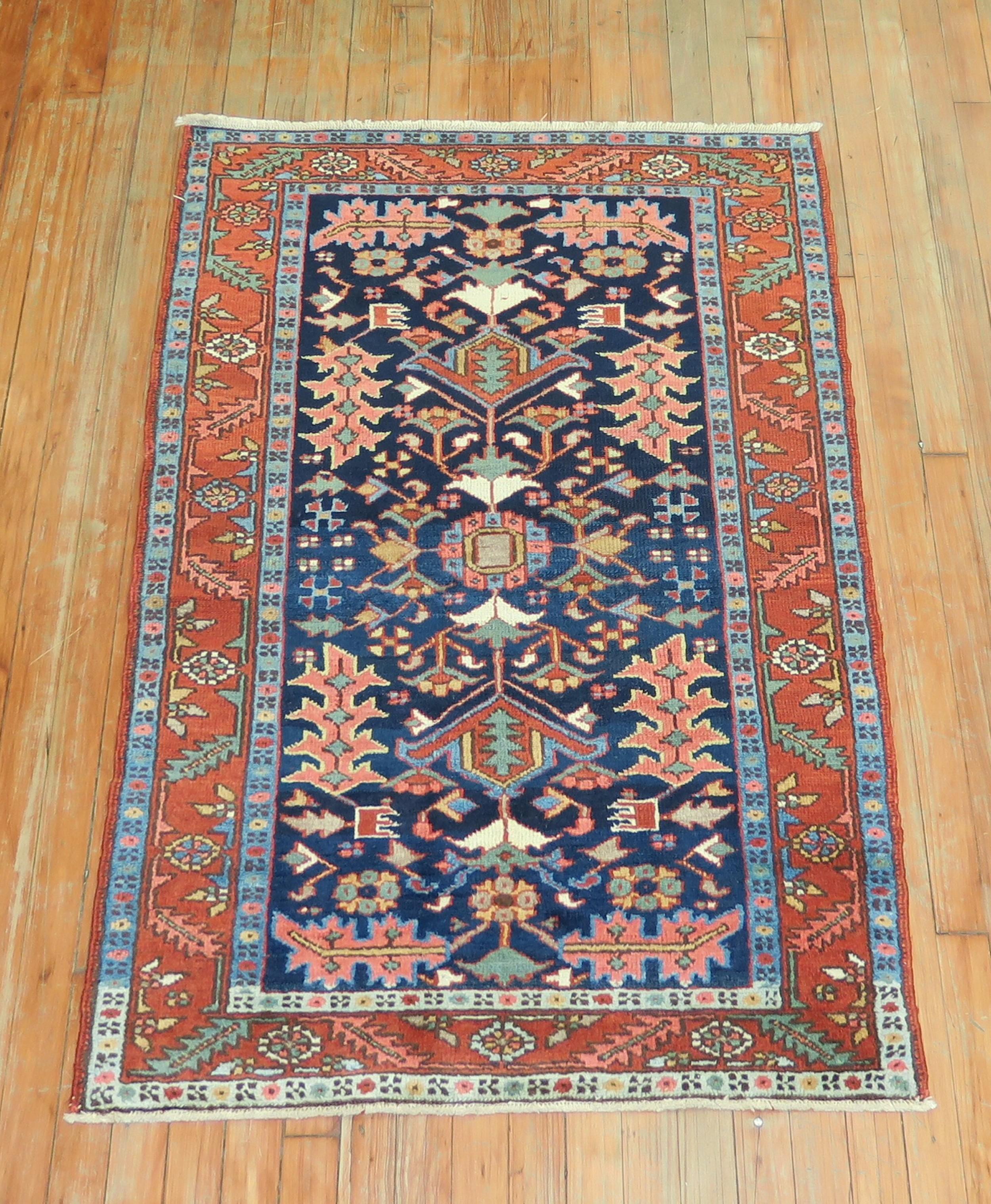Antique Persian Heriz rug with a geometric motif on a vibrant navy blue ground. Great condition & quality. If you appreciate oriental Persian rugs then this is one you will always enjoy.

Measures: 2'11” x 4'6”.