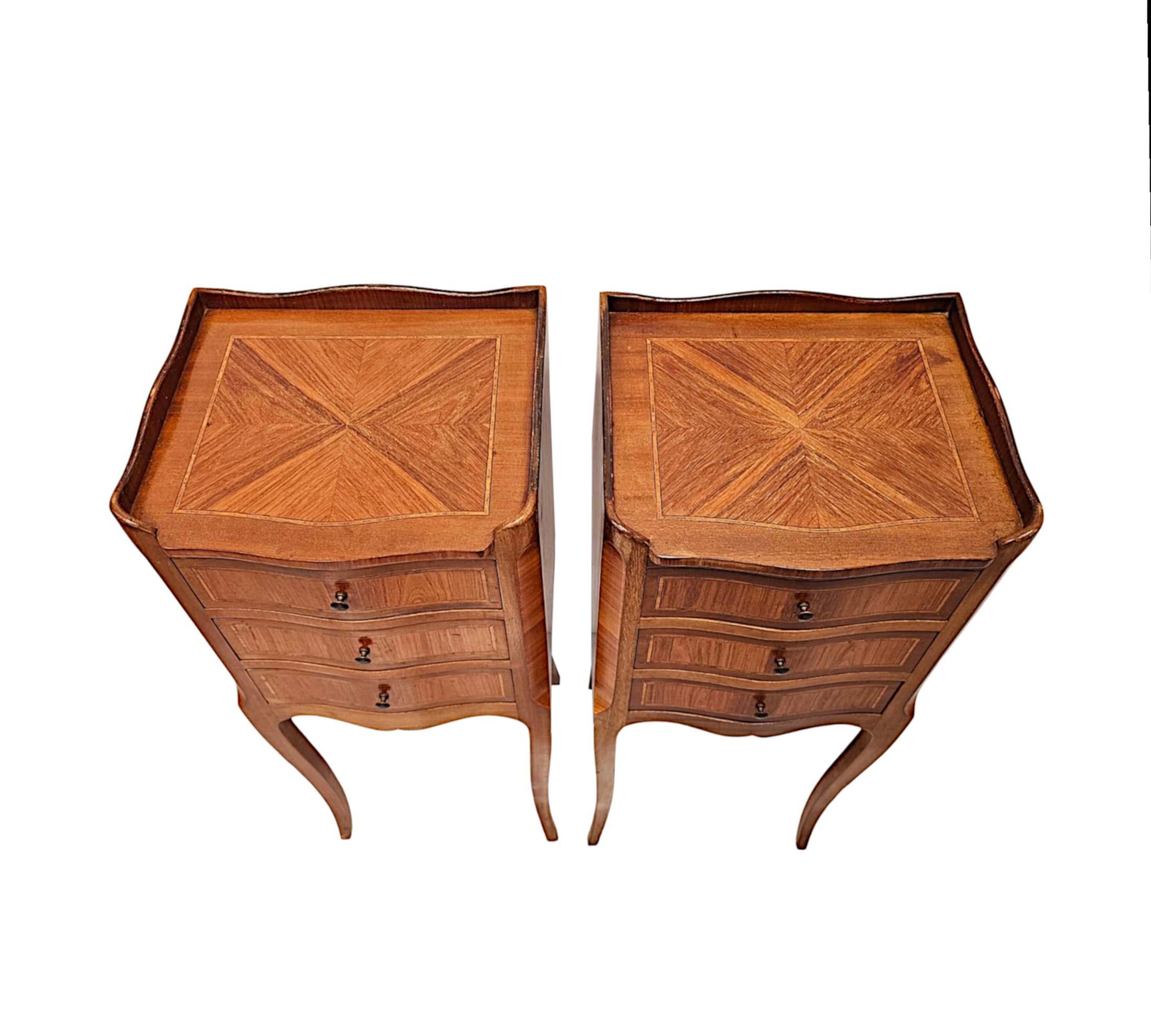 A very fine pair of early 20th Century richly patinated mahogany and kingwood bedside chests of exceptional quality and neat proportions.  This stunning pair are beautifully carved, quarter veneered with delicate line inlay detail throughout.  The
