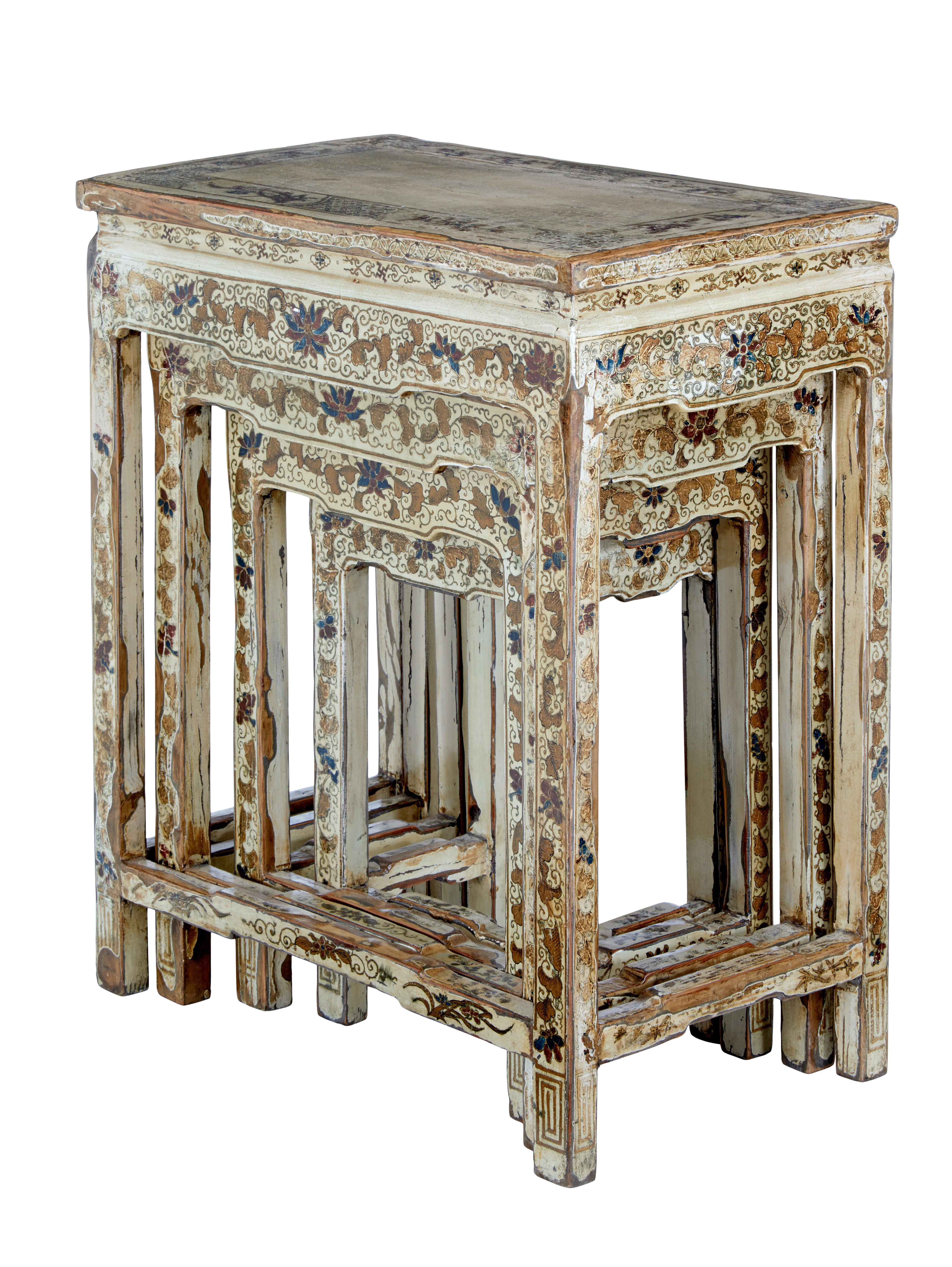 Early 20th century nest of 4 lacquered and decorated tables circa 1900.

Stunning set of 4 Chinese export nesting tables. Each profusely hand decorated with paint and gold leaf. Each standing on 4 legs with a back stretcher making these nesting,