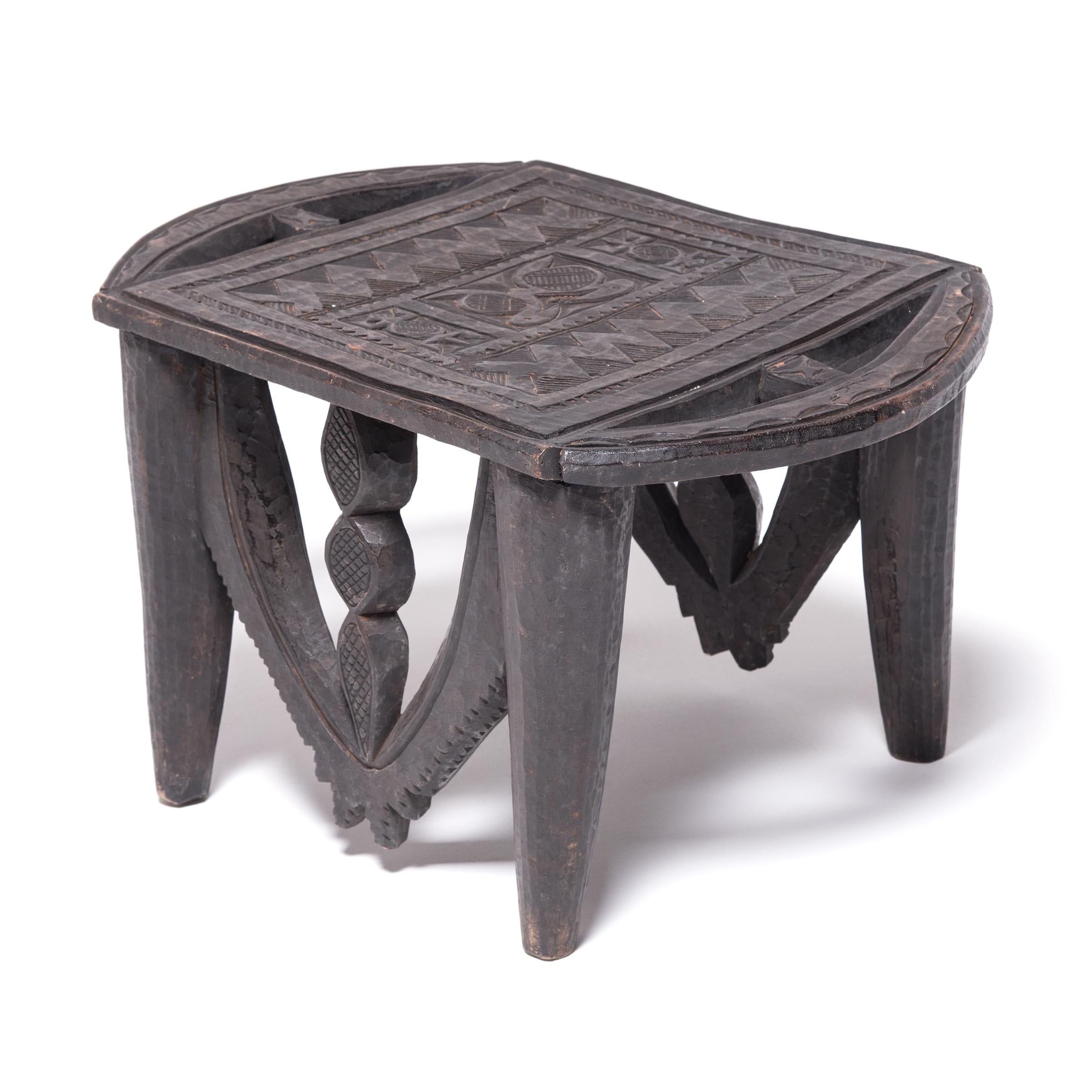 The Nupe people express the widest variety of stool forms among African tribes. Each is carved from a single piece of wood, decorated with abstract designs, and - most notably - cut so that the grain of the wood always runs horizontally. The mixture