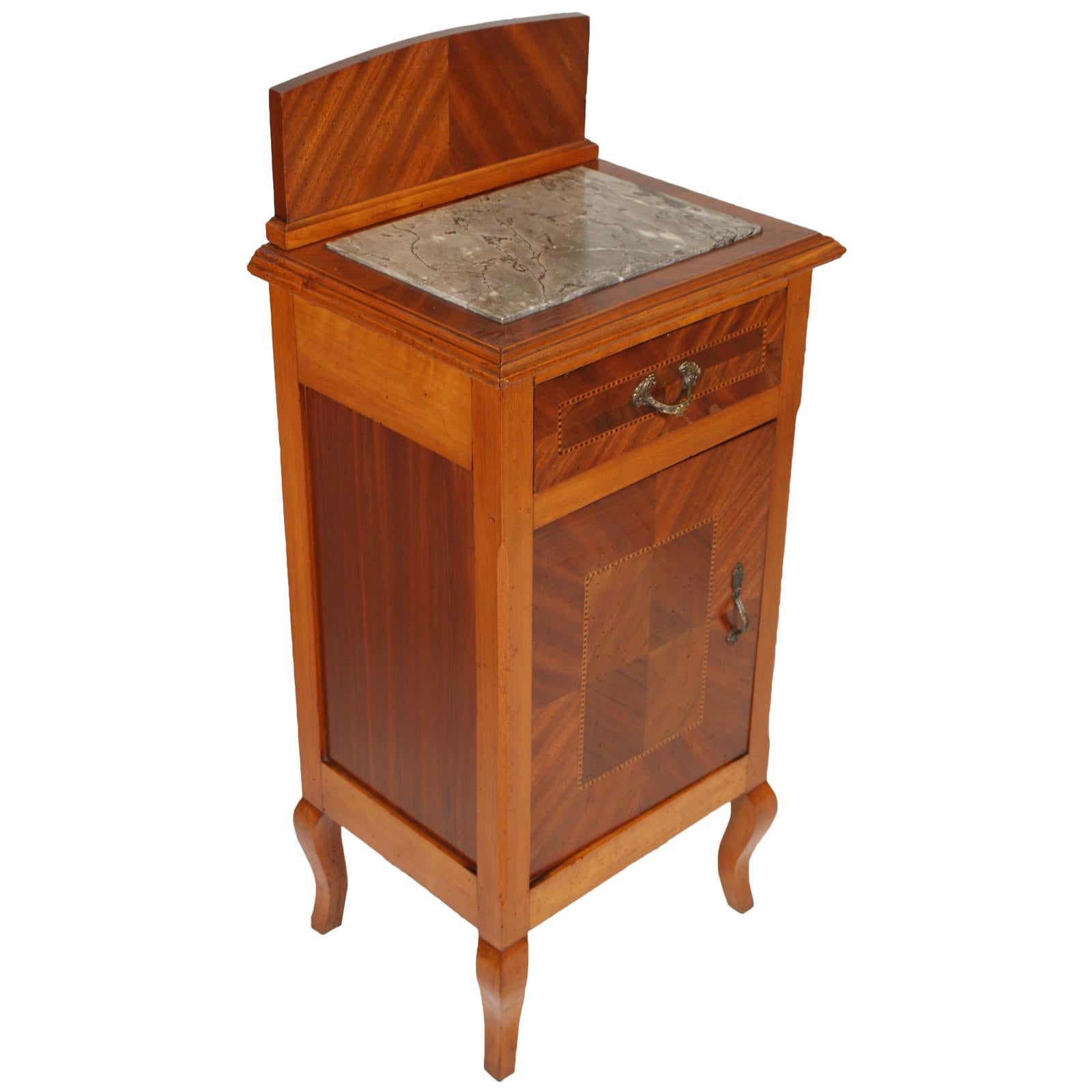 Pair of original Art Nouveau nightstands . Finely inlaid walnut with walnut, mahogany and maple folder. Stand with a mahogany herringbone folder. Gray marble top. Upper drawer and lower door inlaid with a herringbone pattern. Sides in mahogany