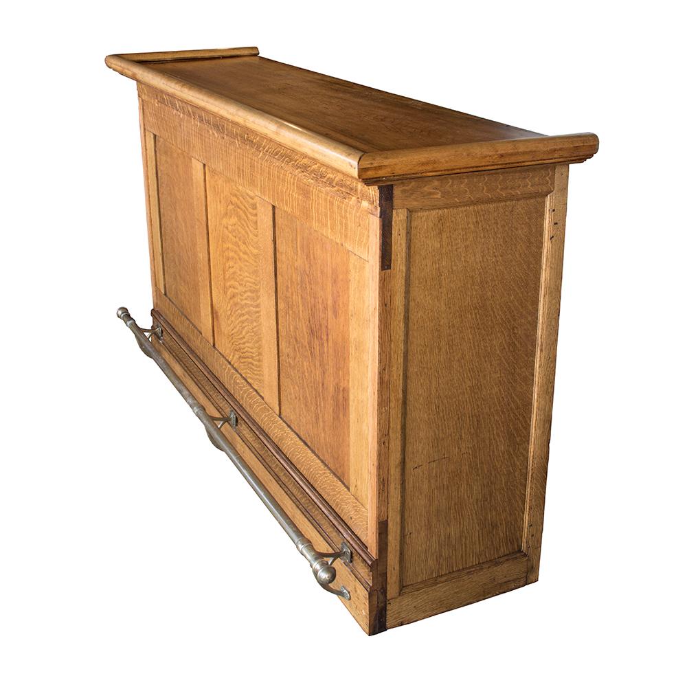 This solid oak front bar has a Classic silhouette and simple design, complete with its original brass rail.