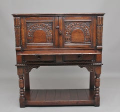 Early 20th Century Ipswich carved Oak Drinks Cabinet with brushing slide