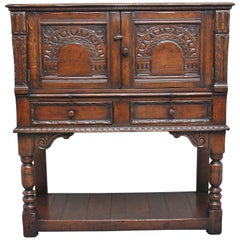 Early 20th Century Ipswich carved Oak Drinks Cabinet with brushing slide
