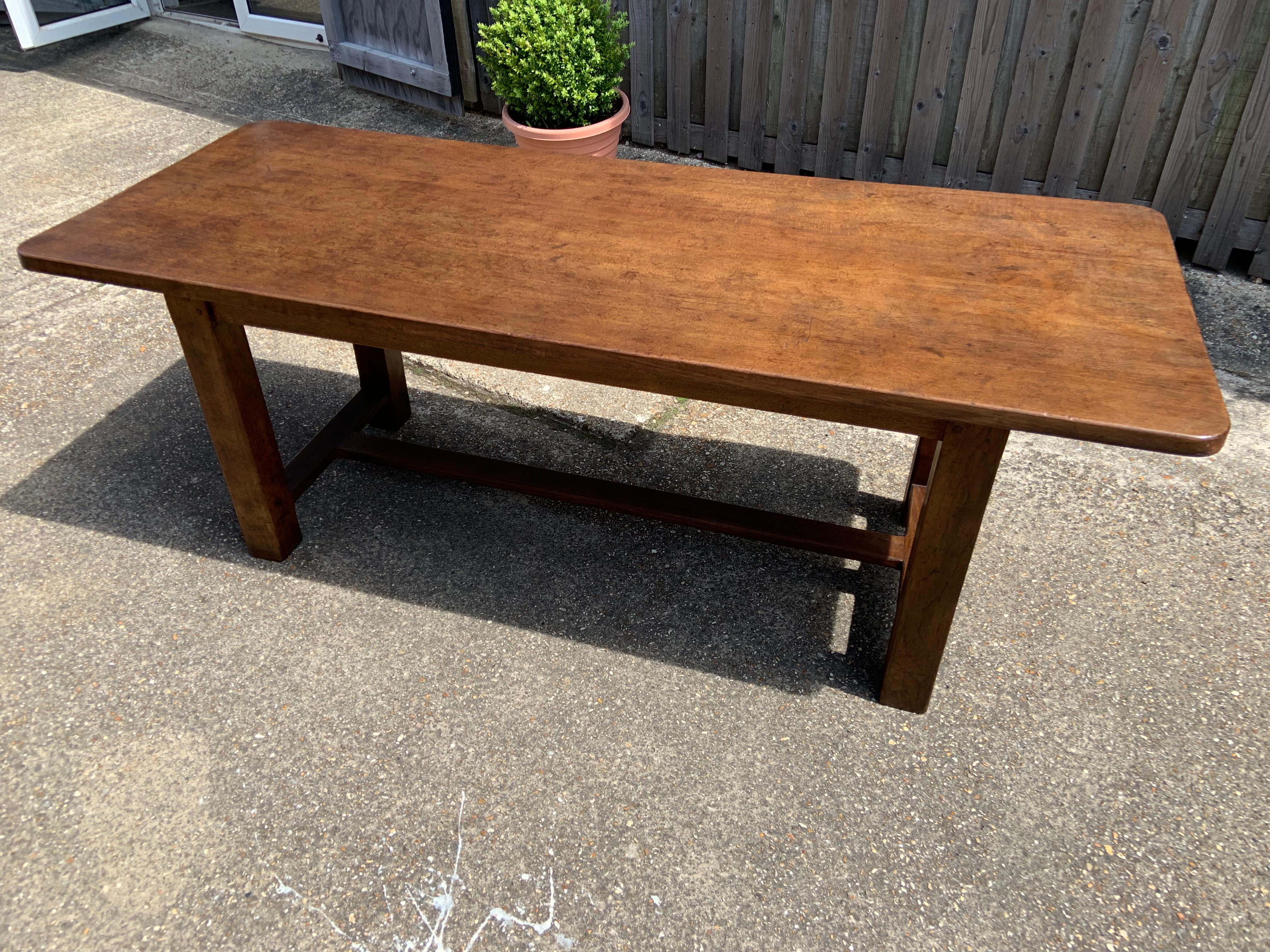 Early 20th century Oak farmhouse Table with centre stretcher. This table stands very well and is very sturdy. Gorgeous colour. With comfortable leg room.
 