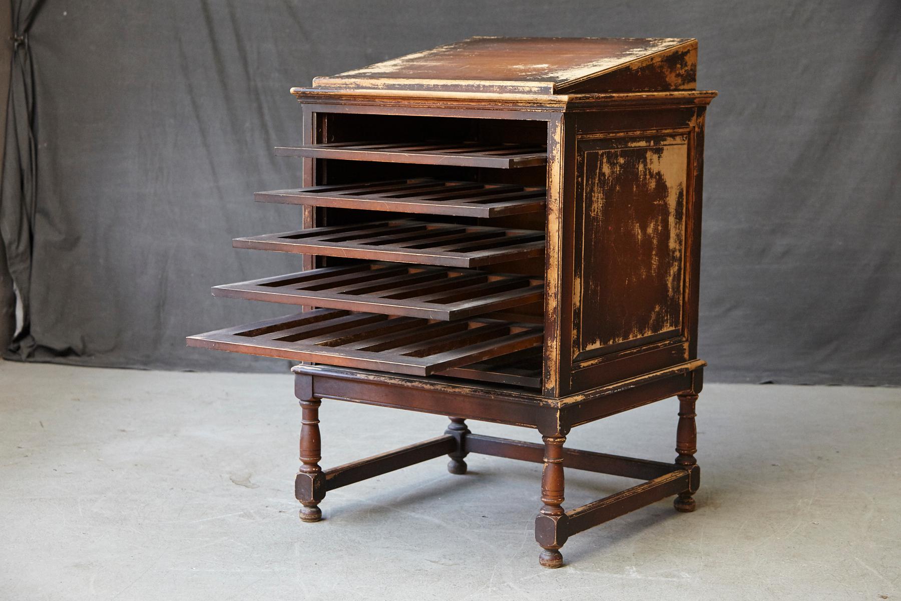 Very attractive early 20th century oak stand up desk with slant top, five sliding racks and paneled sides, relief brass placard 'LB Library Bureau Makers LB' on the backside of the desk.
Sturdy and heavy quality construction. The desk has been