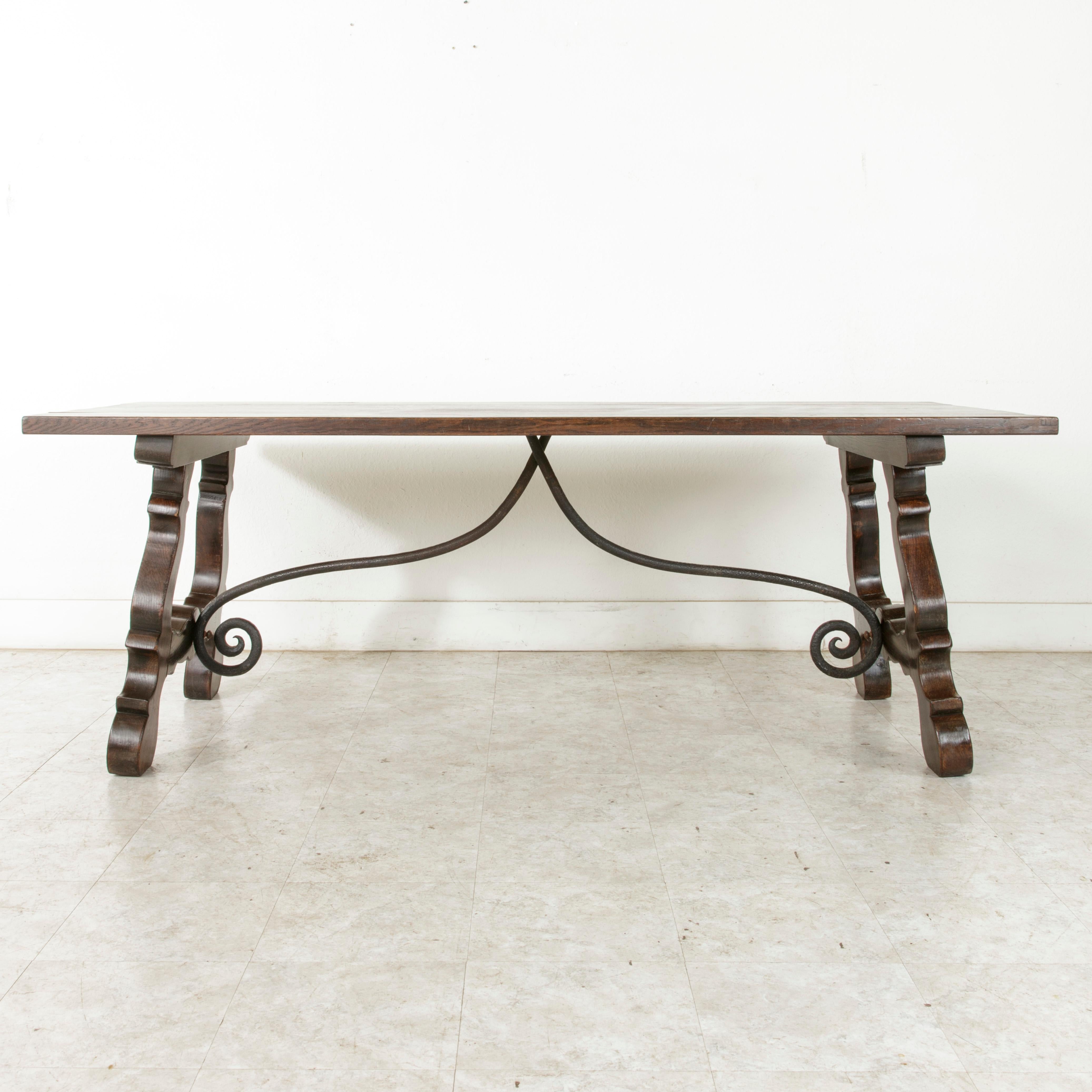 French Early 20th Century Oak Spanish Renaissance Style Dining Table, Iron Stretcher