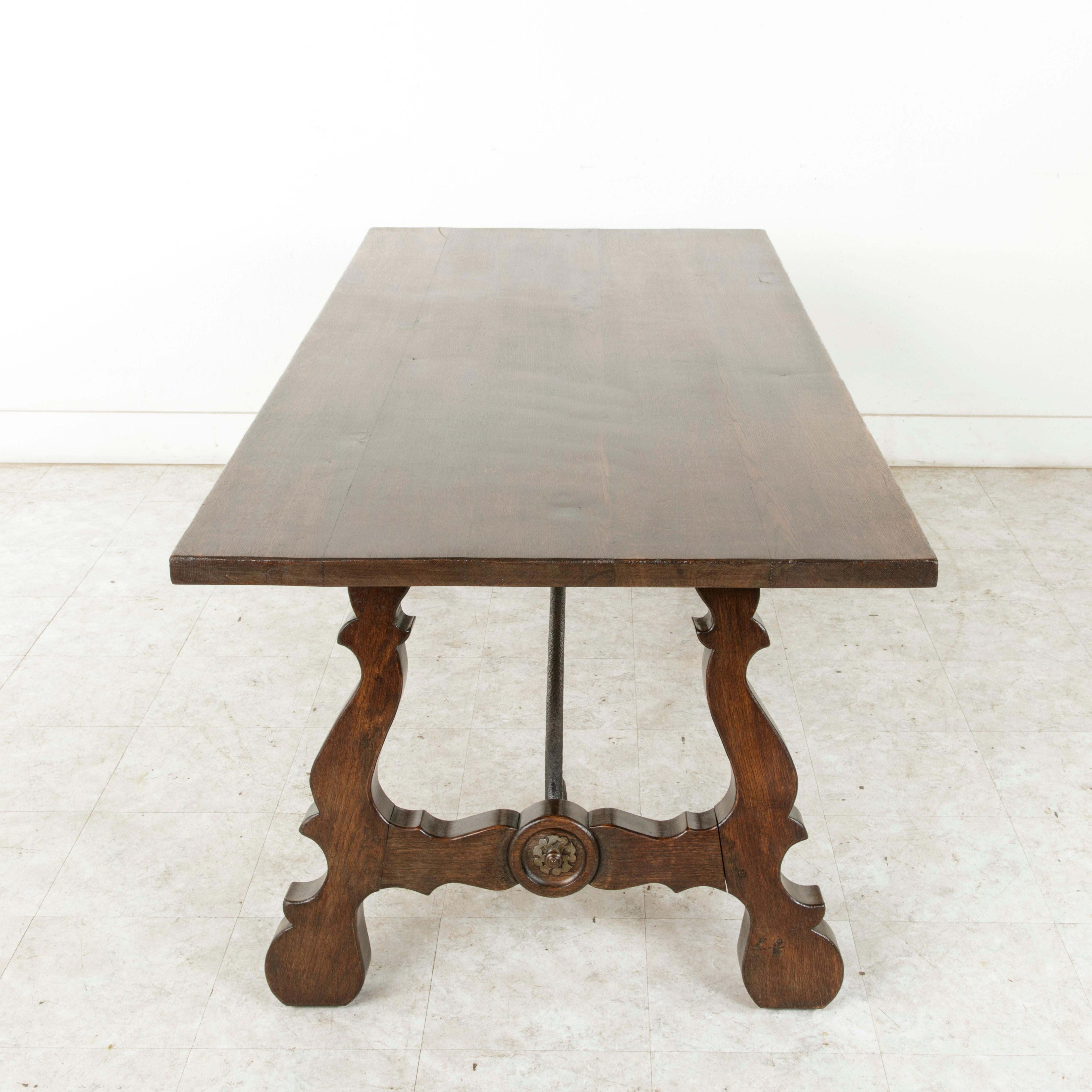 Forged Early 20th Century Oak Spanish Renaissance Style Dining Table, Iron Stretcher