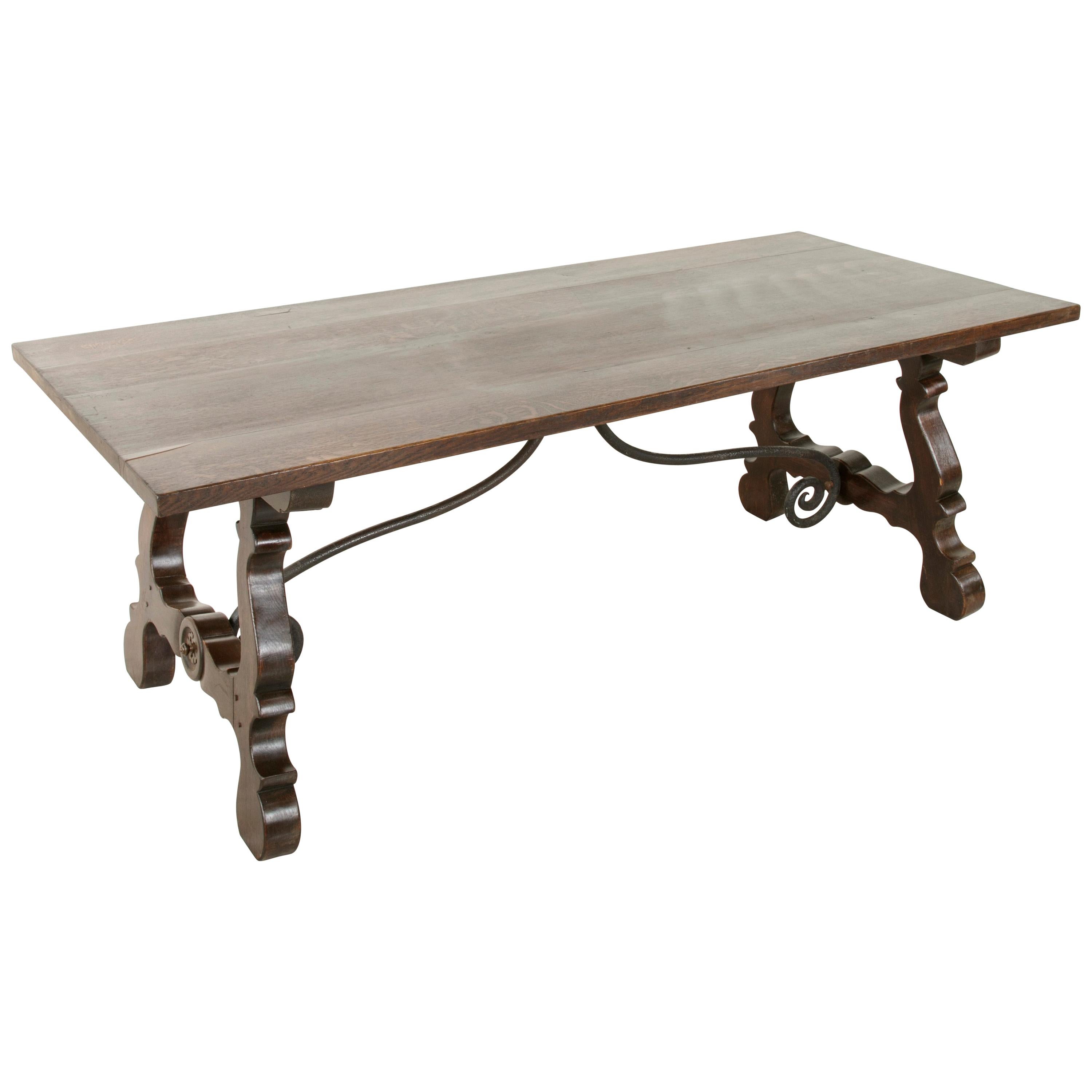 Early 20th Century Oak Spanish Renaissance Style Dining Table, Iron Stretcher