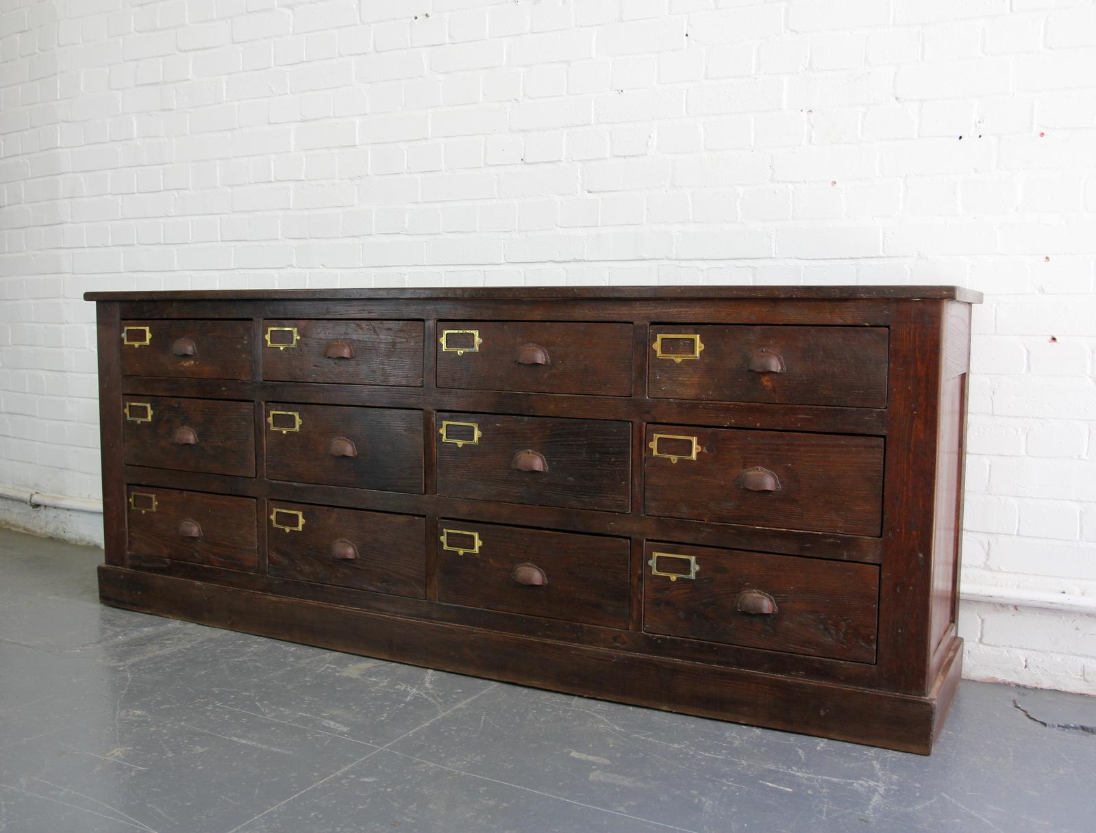 Early 20th century oak workshop drawers, circa 1900

- Sold Oak top, sides, back and drawers
- Original cast steel handles
- Brass card holders
- French, circa 1900
- 207cm long x 44cm deep x 80cm tall

Condition report:

The unit has been