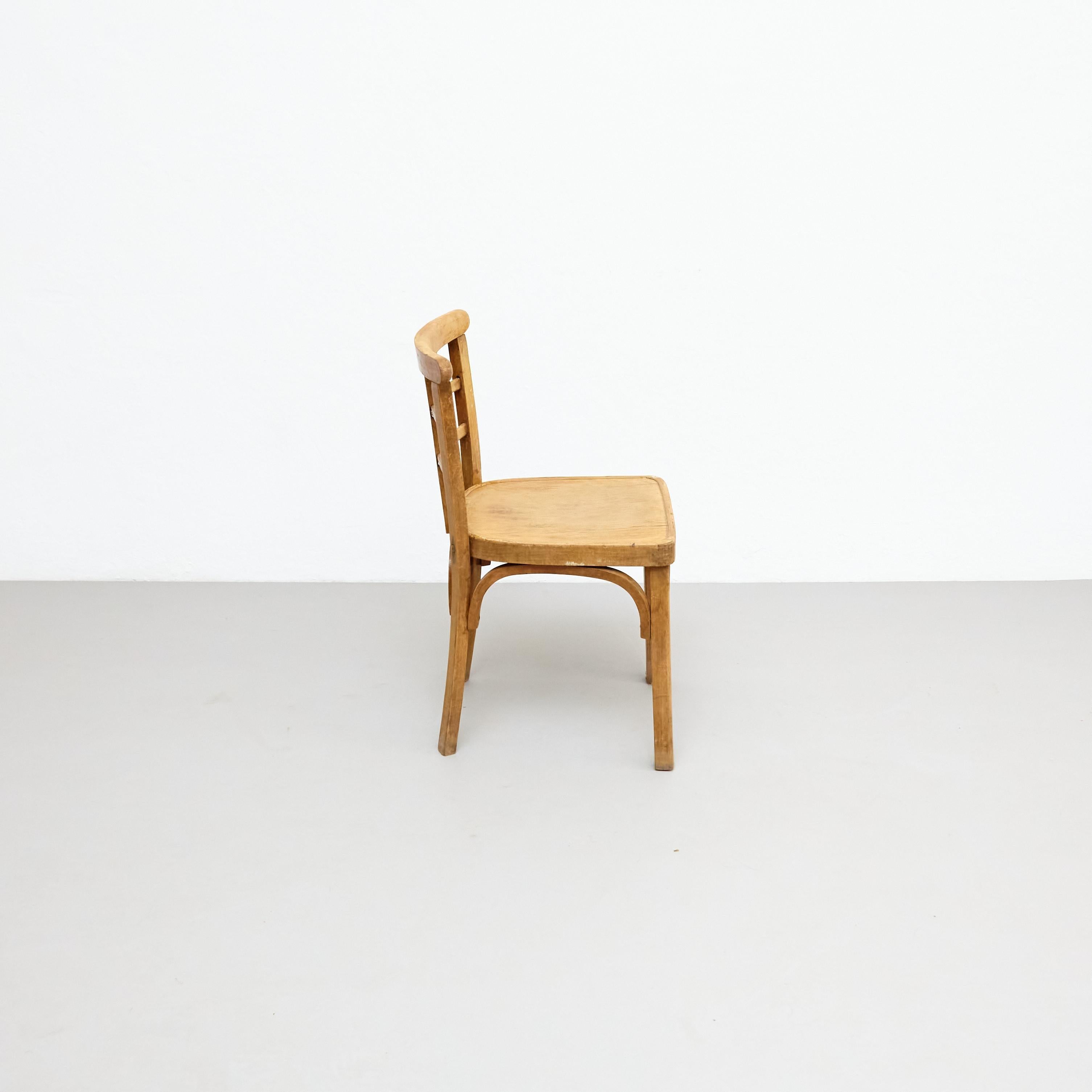 Silla de madera de oficina de principios del siglo XX, hacia 1940 en Bueno estado para la venta en Barcelona, ES