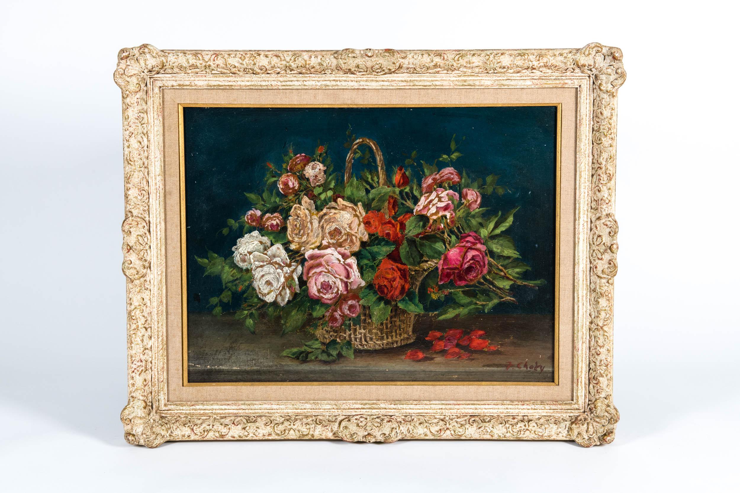 Early 20th century oil on board still life painting of flowers with wood frame. Artist signature on the lower left corner. The painting is in excellent vintage condition, minor wear the frame consistent with age / use. The painting measure about 23
